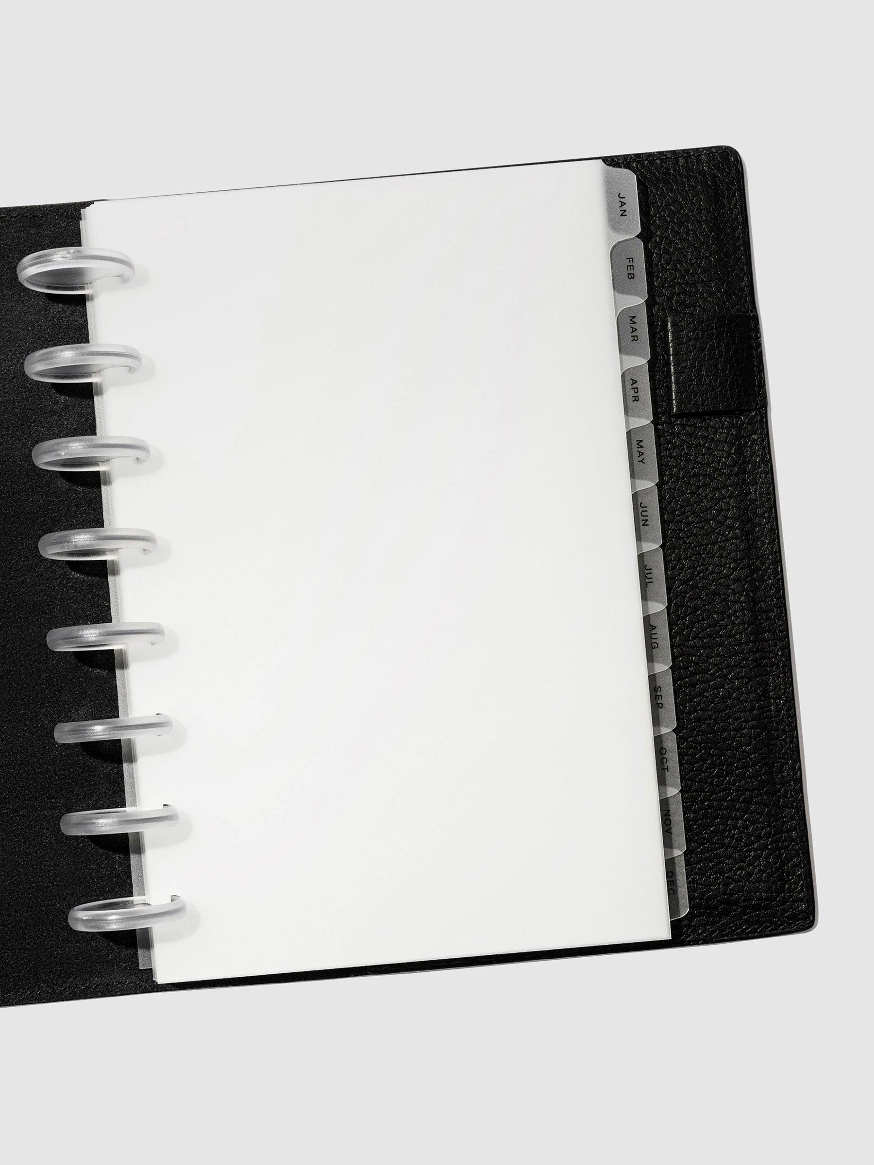 Black foil tabs displayed in use inside a black leather folio.