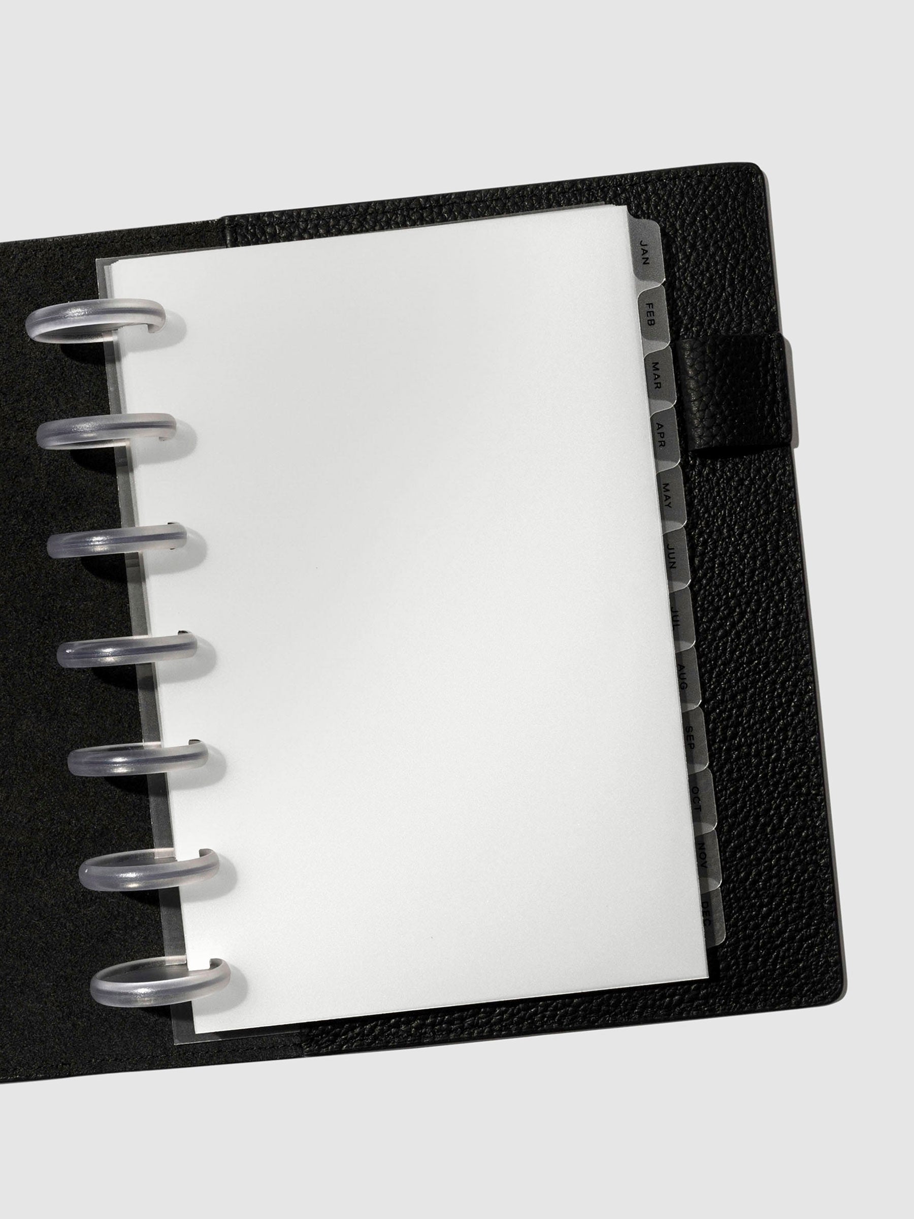Black foil tabs displayed in use inside a black leather folio.