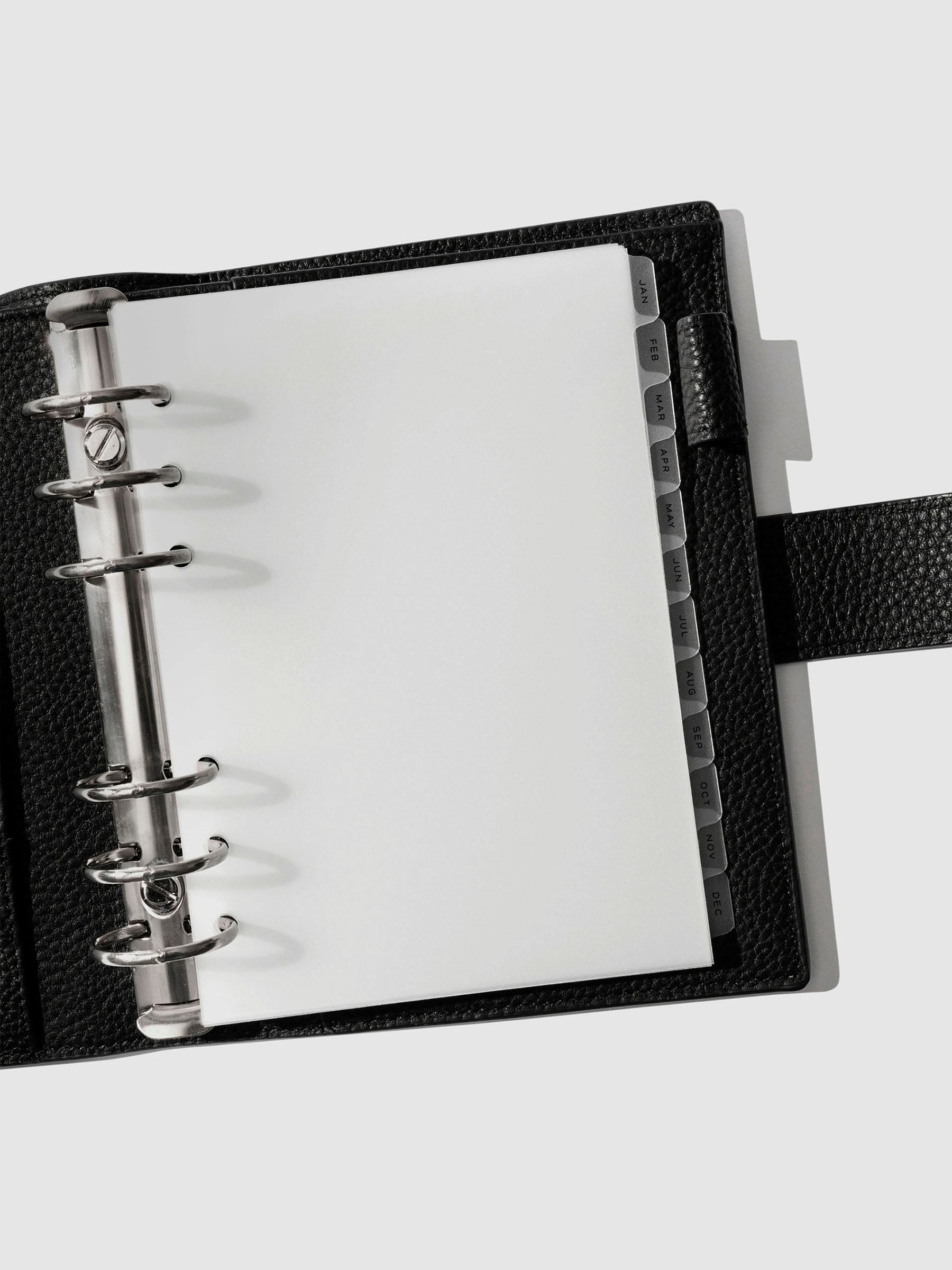 Black foil tabs displayed in use inside a black leather folio.