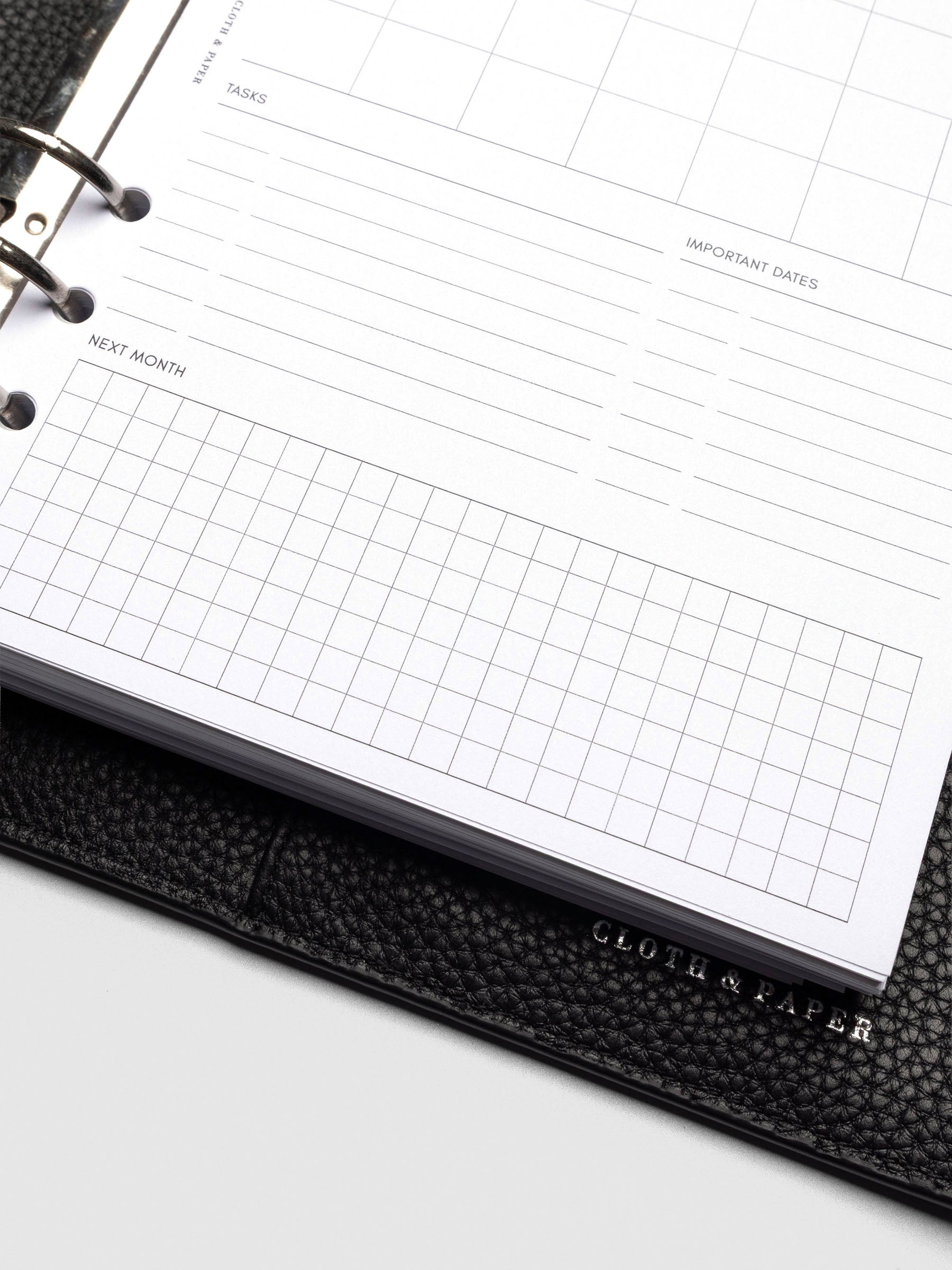 Insert in use inside a black leather planner.