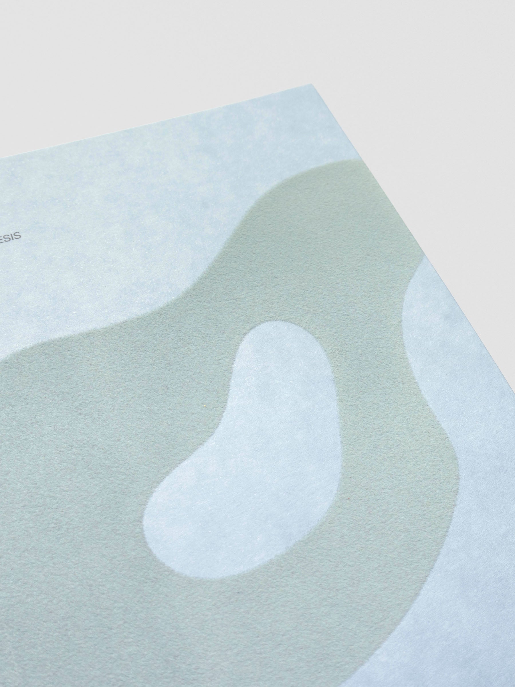 Close up of blue-green flocking on the organic shape design displaying a velvet-like texture.