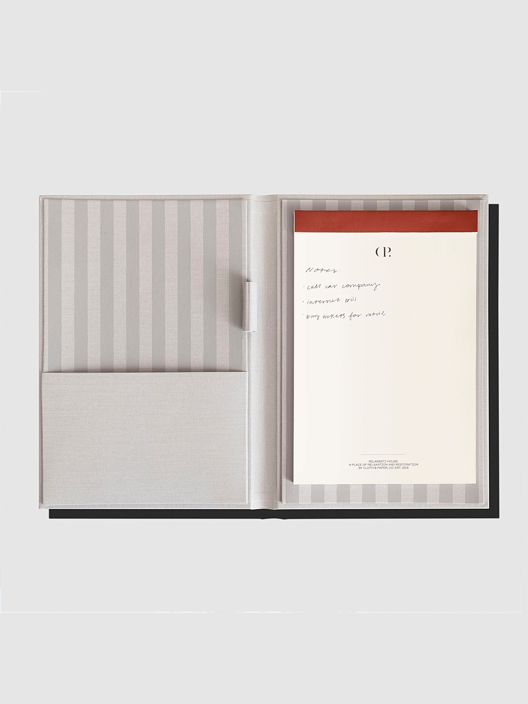 Notepad Folio, Rilassati, Cloth and Paper. Folio displayed with notepad inside it on a neutral background.