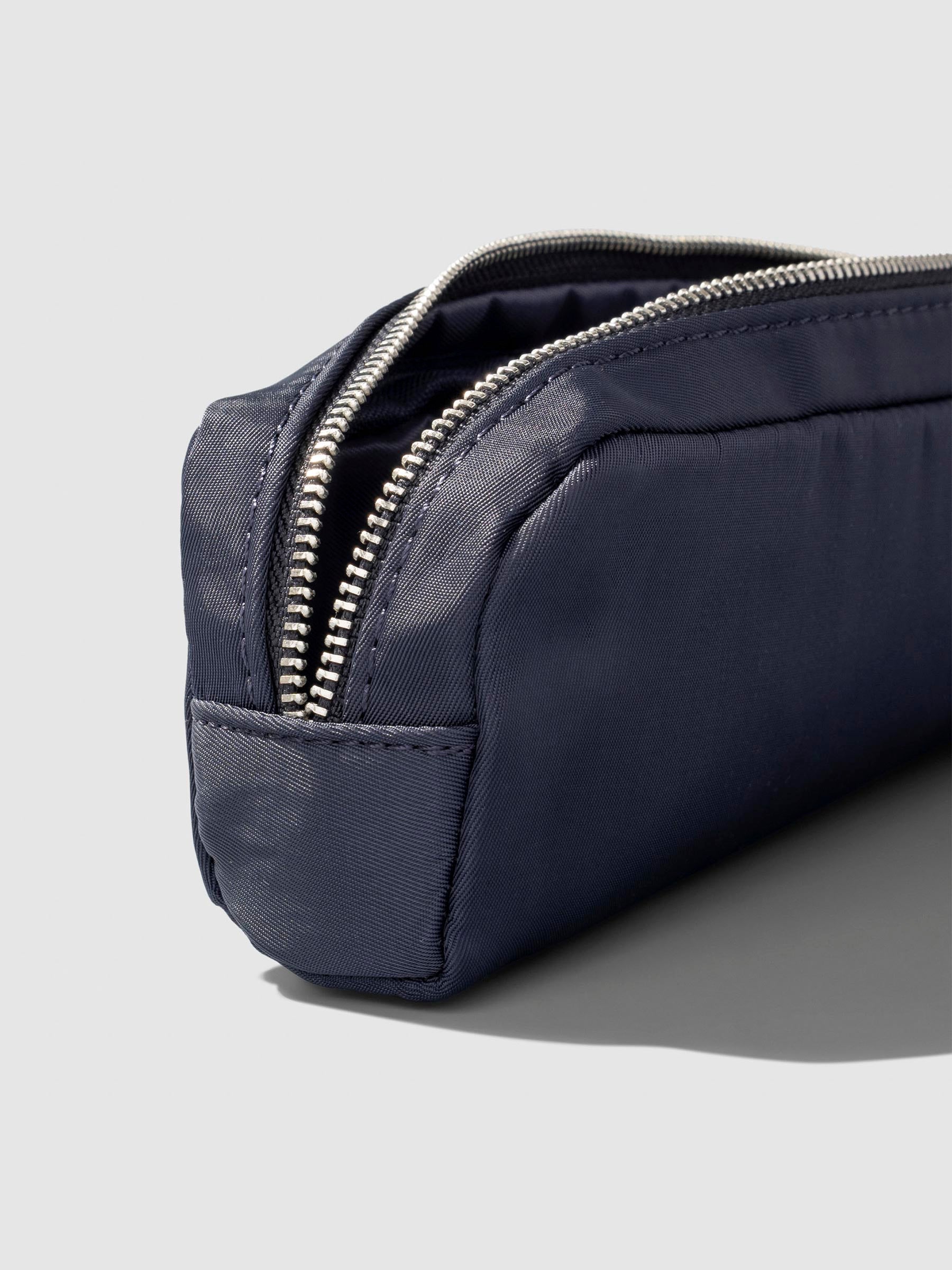 Closeup of pencil pouch's zipper. Color featured is Apollo.