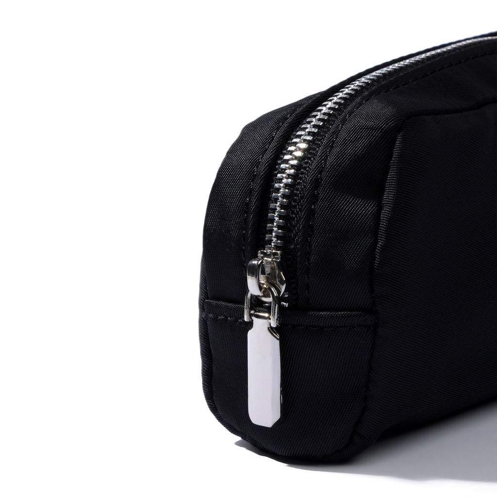 Closeup of pencil pouch's zipper. Color featured is black.