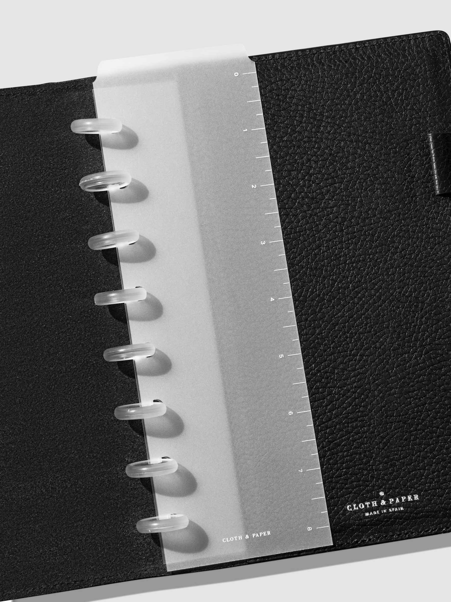 Page marker in use inside a black leather agenda.