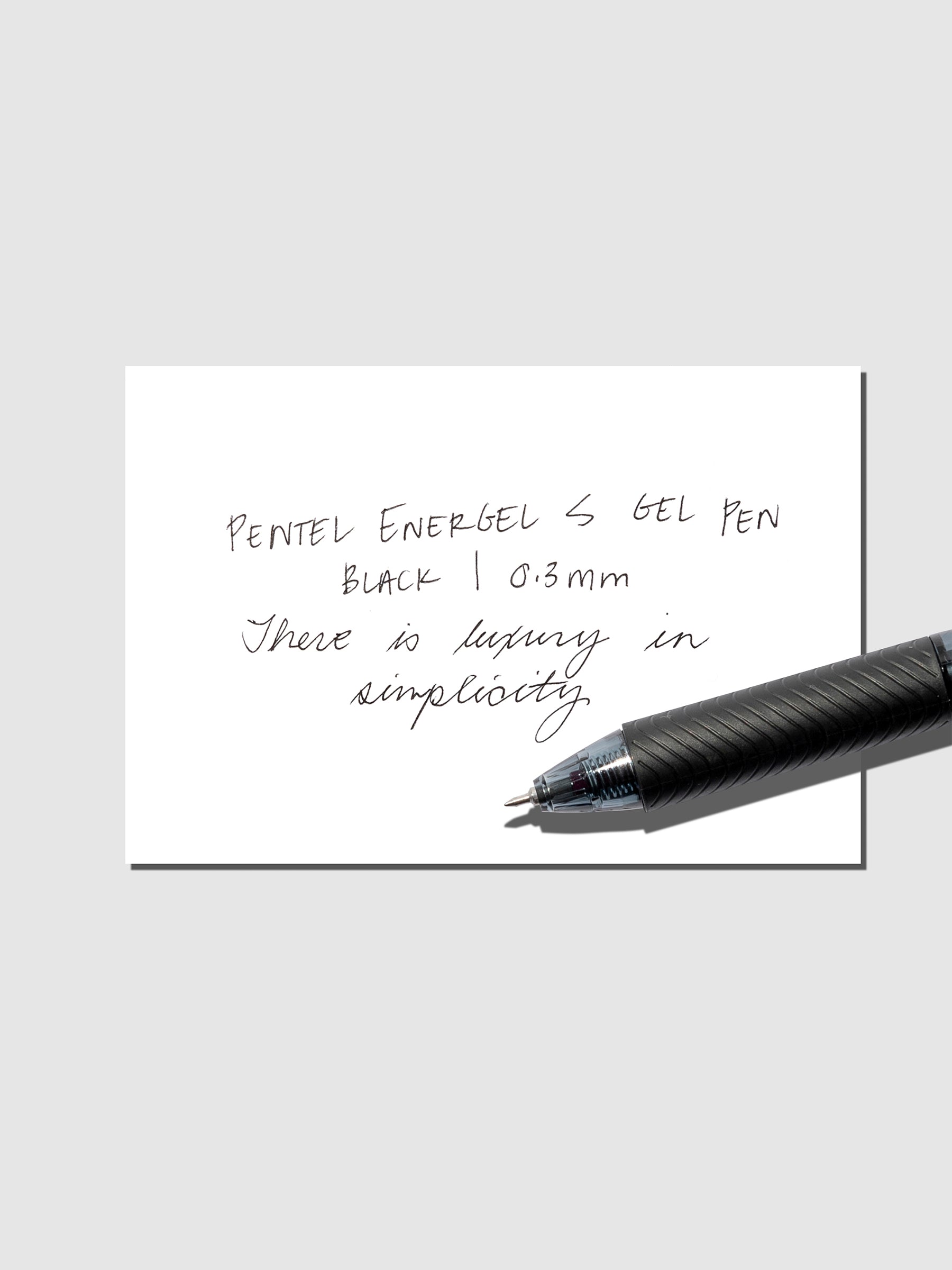Writing sample with a Pentel EnergelS Gelpen displayed on a neutral background.