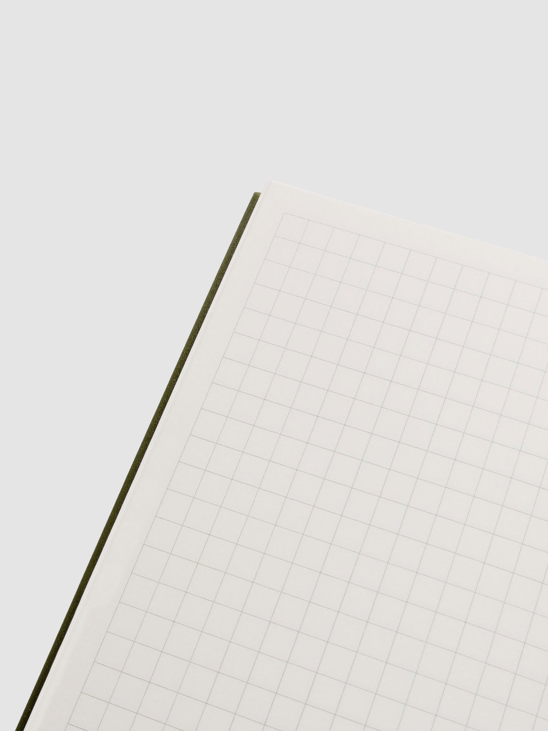 Close up of the open Perfect Bound Notebook | CP Petite | Graph | Olive showing graph style pages.