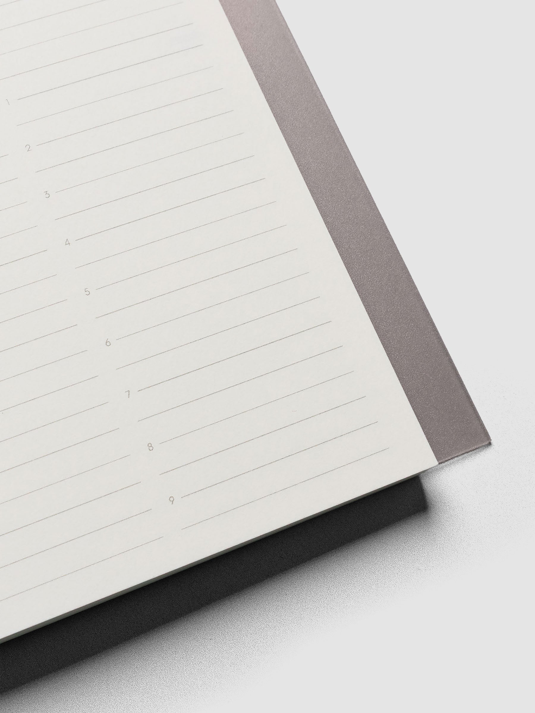 Perfect Bound Notebook | CP Petite | Undated Daily | Verona shown open, laying flat, on a neutral background. Each page has a header for date, priorities, tasks, and schedule.