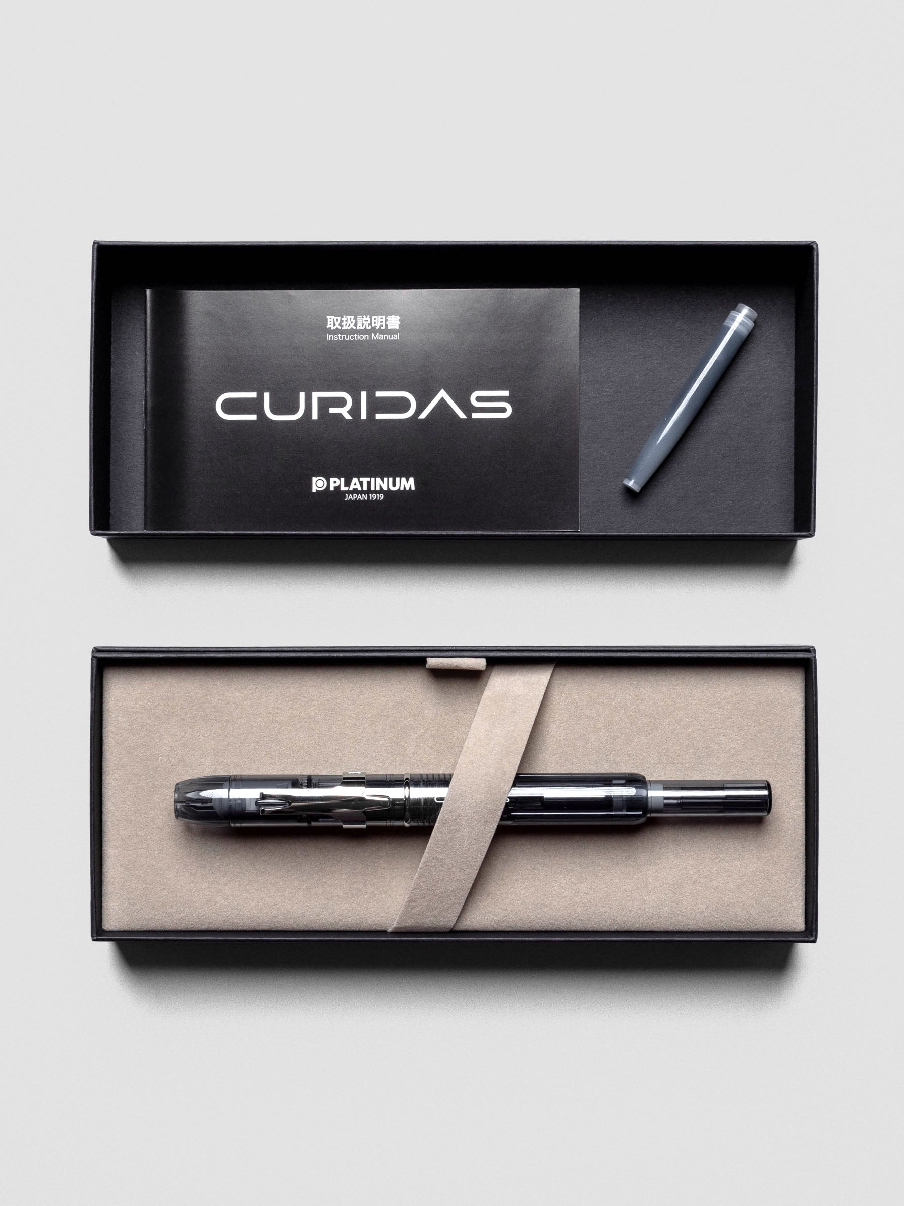 Detail of Platinum Curidas Fountain Pen in Graphite Smoke with fine nib extended.