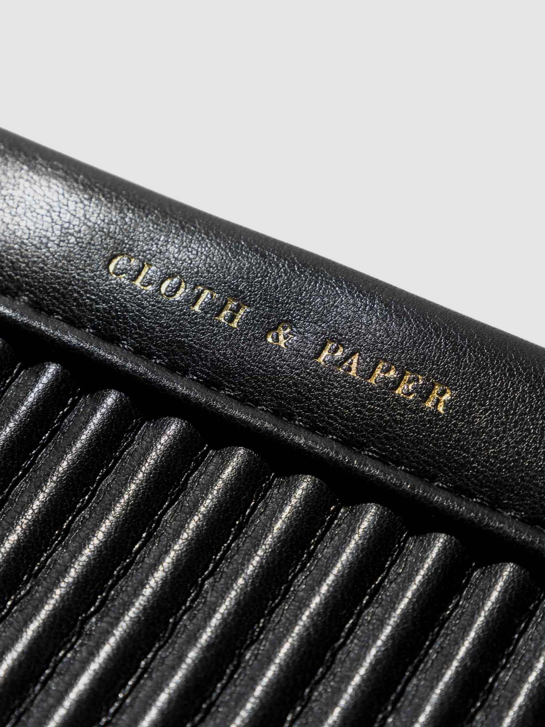 Closeup of gold stamped text on dust bag.