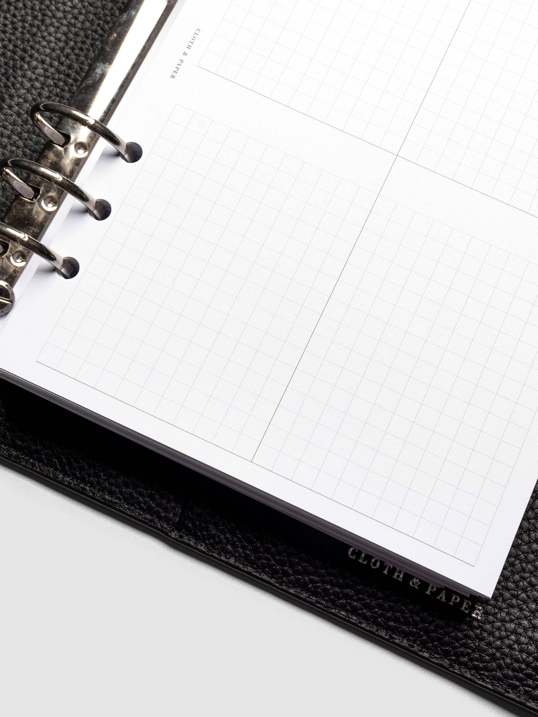 Insert in use inside a black leather planner.