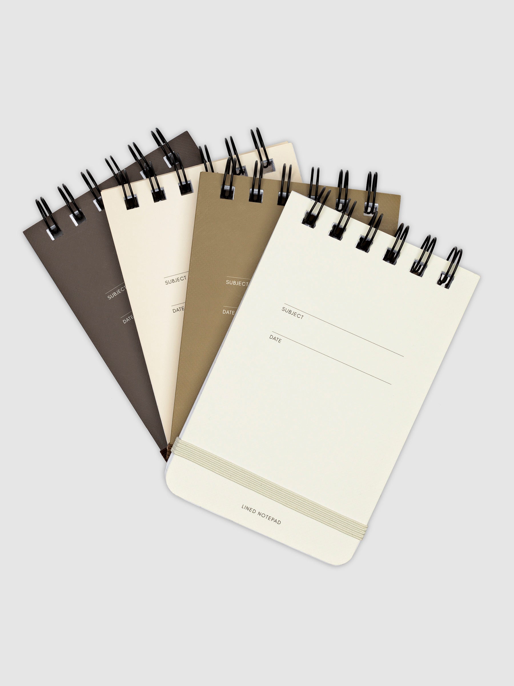 Reporter Notepad, Cloth and Paper. Four notepads arranged together on a neutral background.