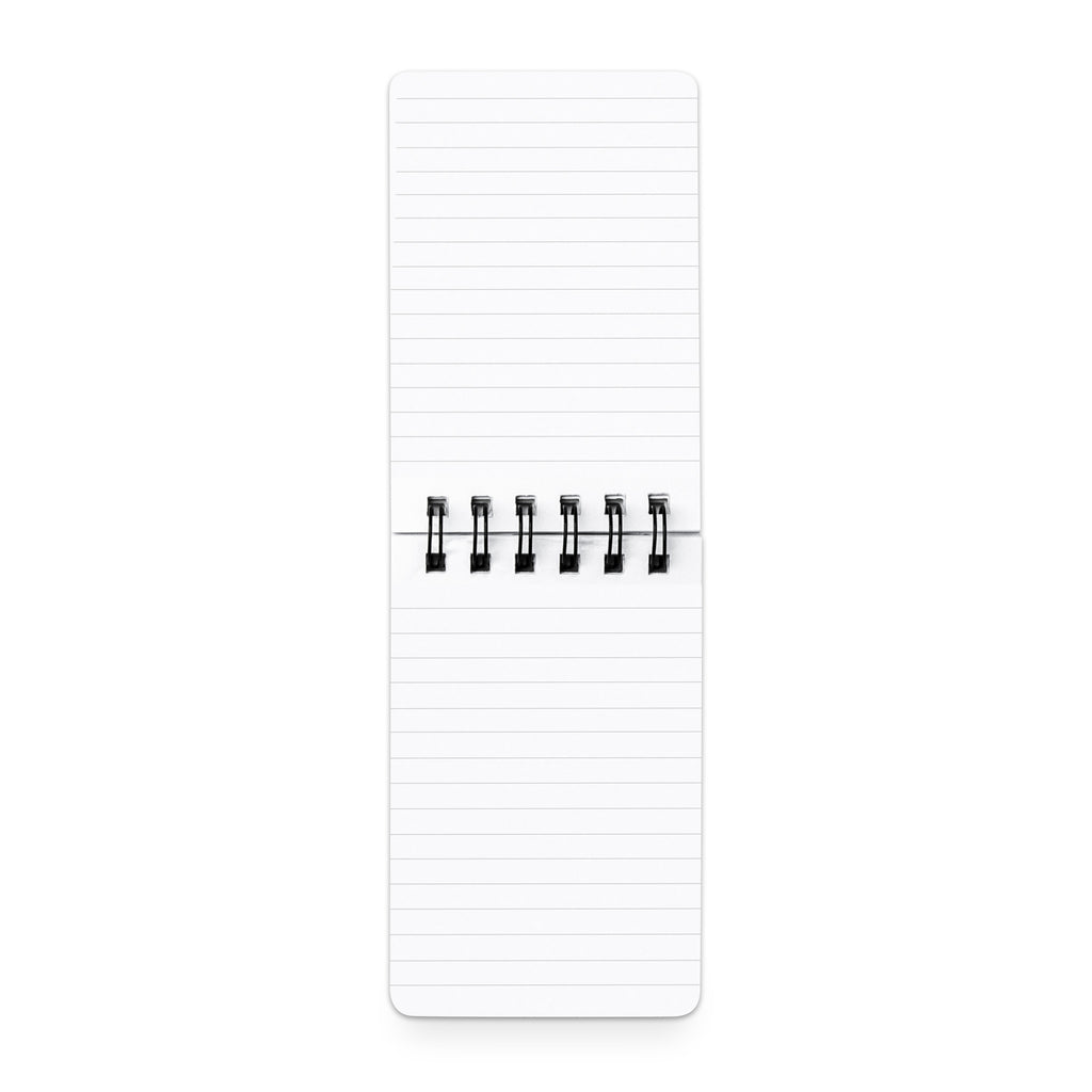 Lined notepad open on a white background.
