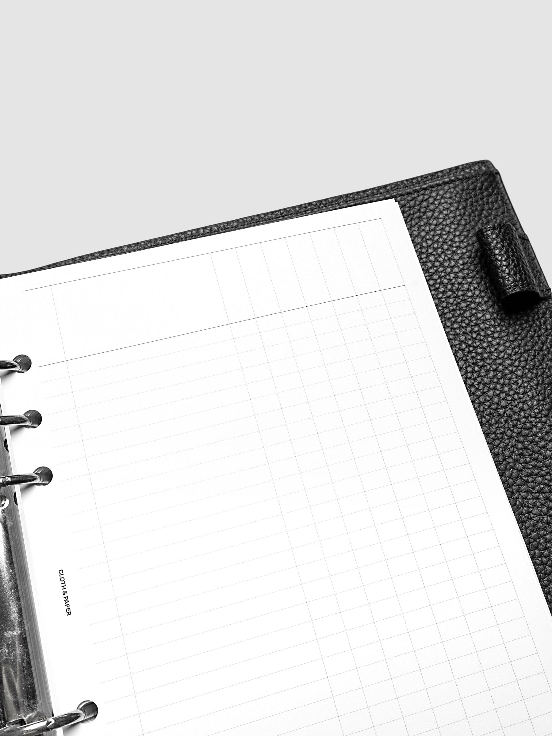 Close up of the Inbox Sorting Planner Inserts shown pre-punched for 6-Ring A5 planners in a black agenda.