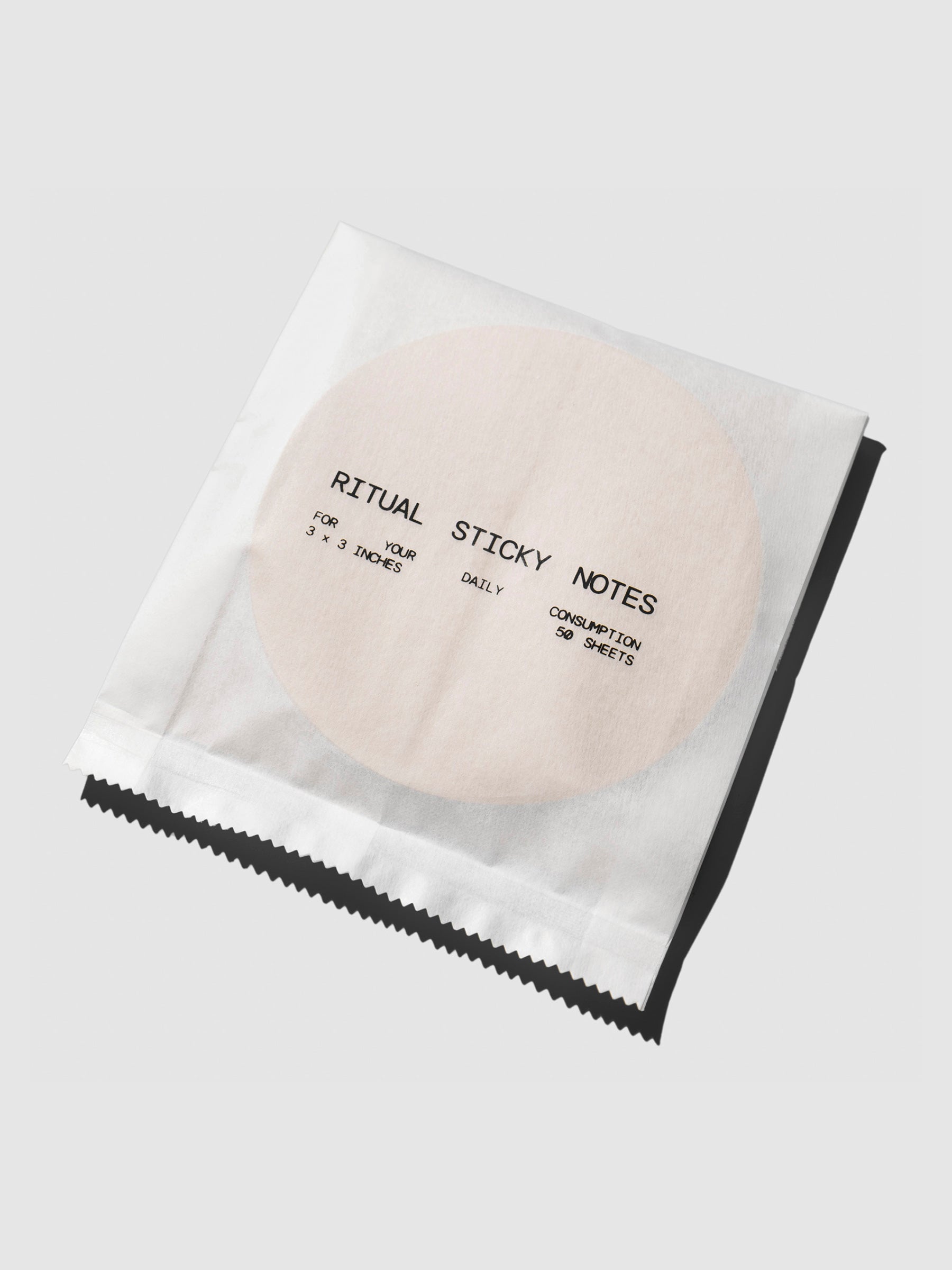 Sticky note displayed in its packaging on a neutral background.