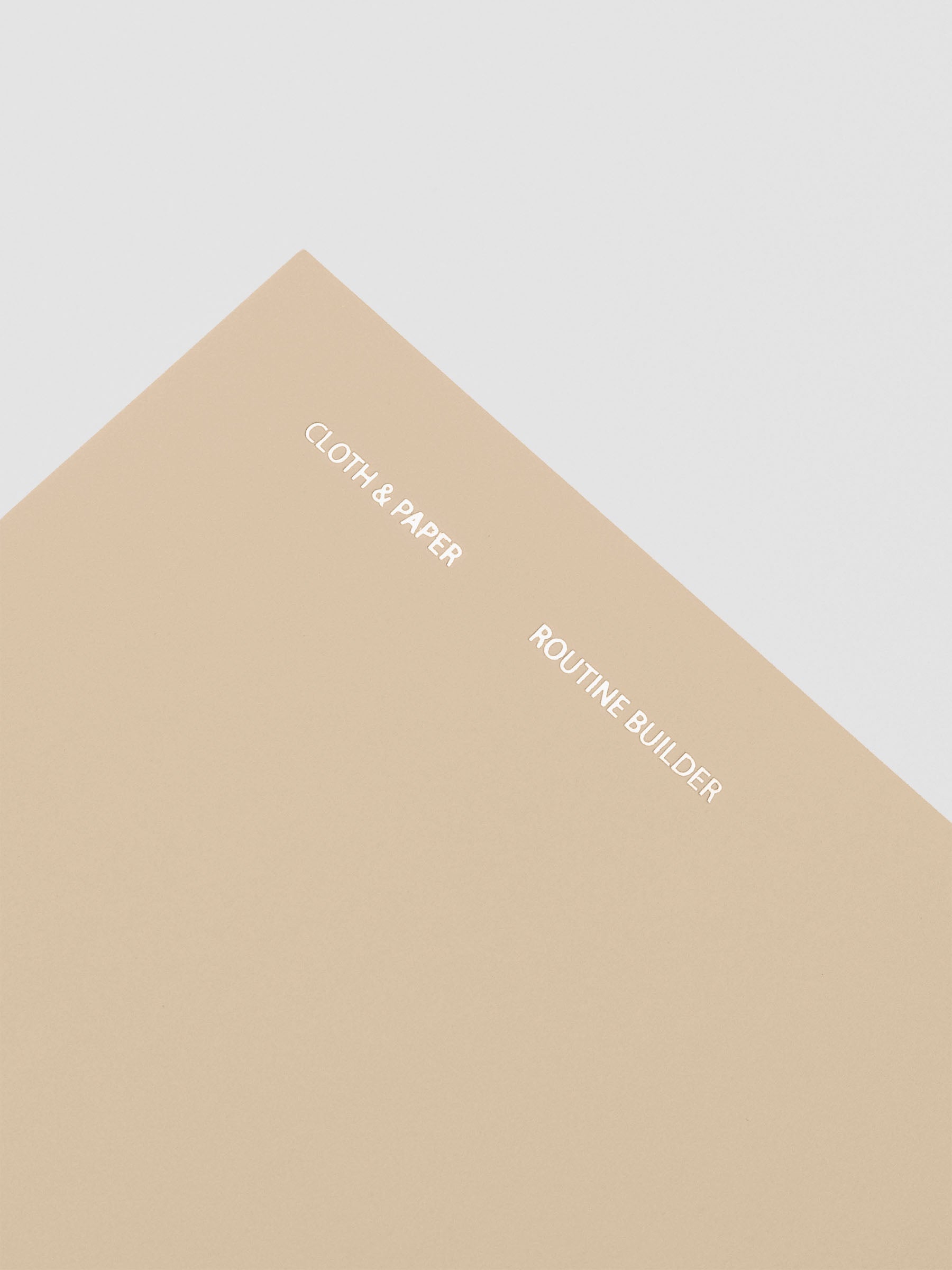 Travel Notebook in size A5 Slim in color Beignet with Routine Builder pages shown from the front.