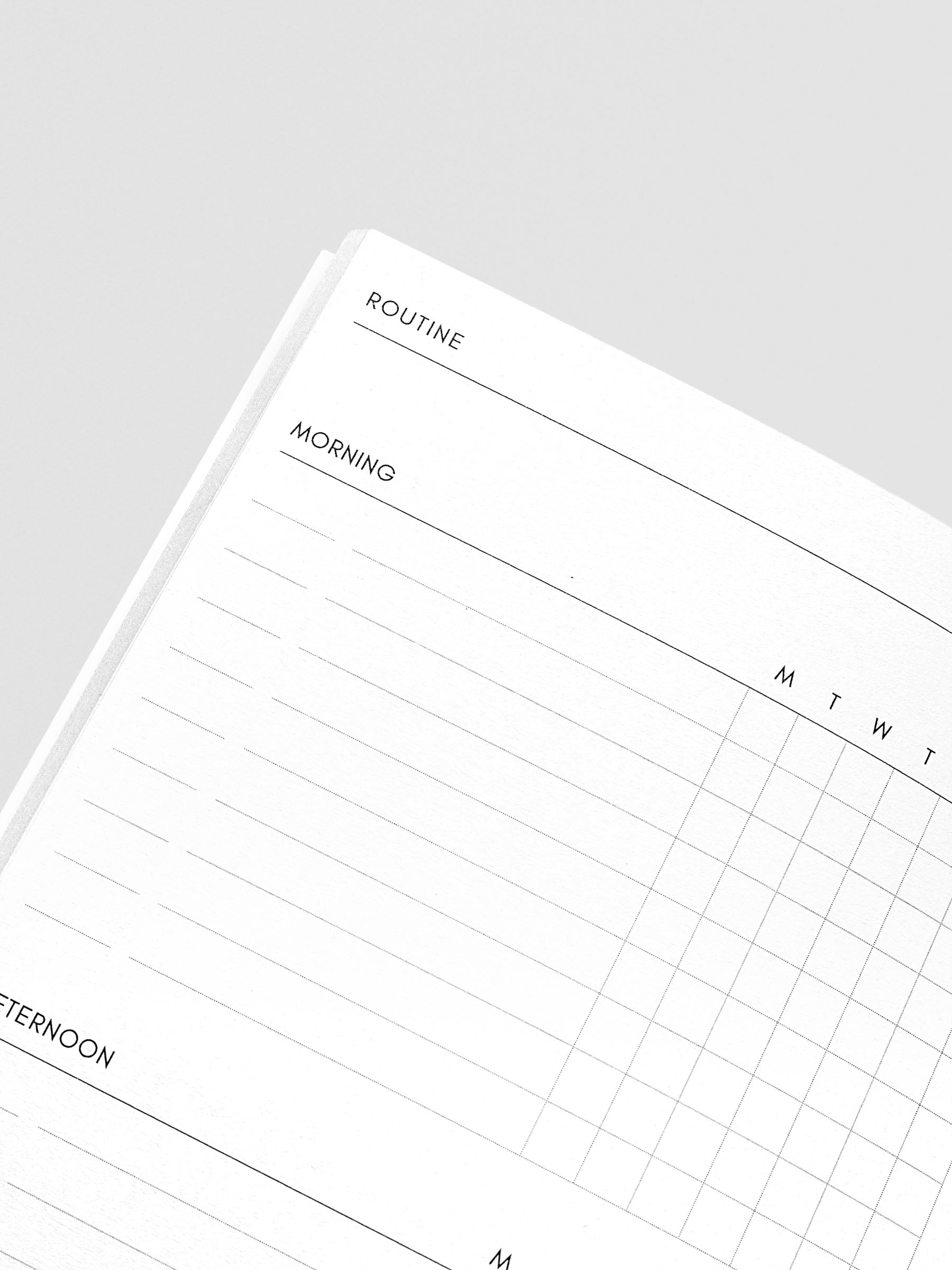 Travel Notebook in size A5 Slim in color Beignet with Routine Builder pages with inner pages shown in close up.