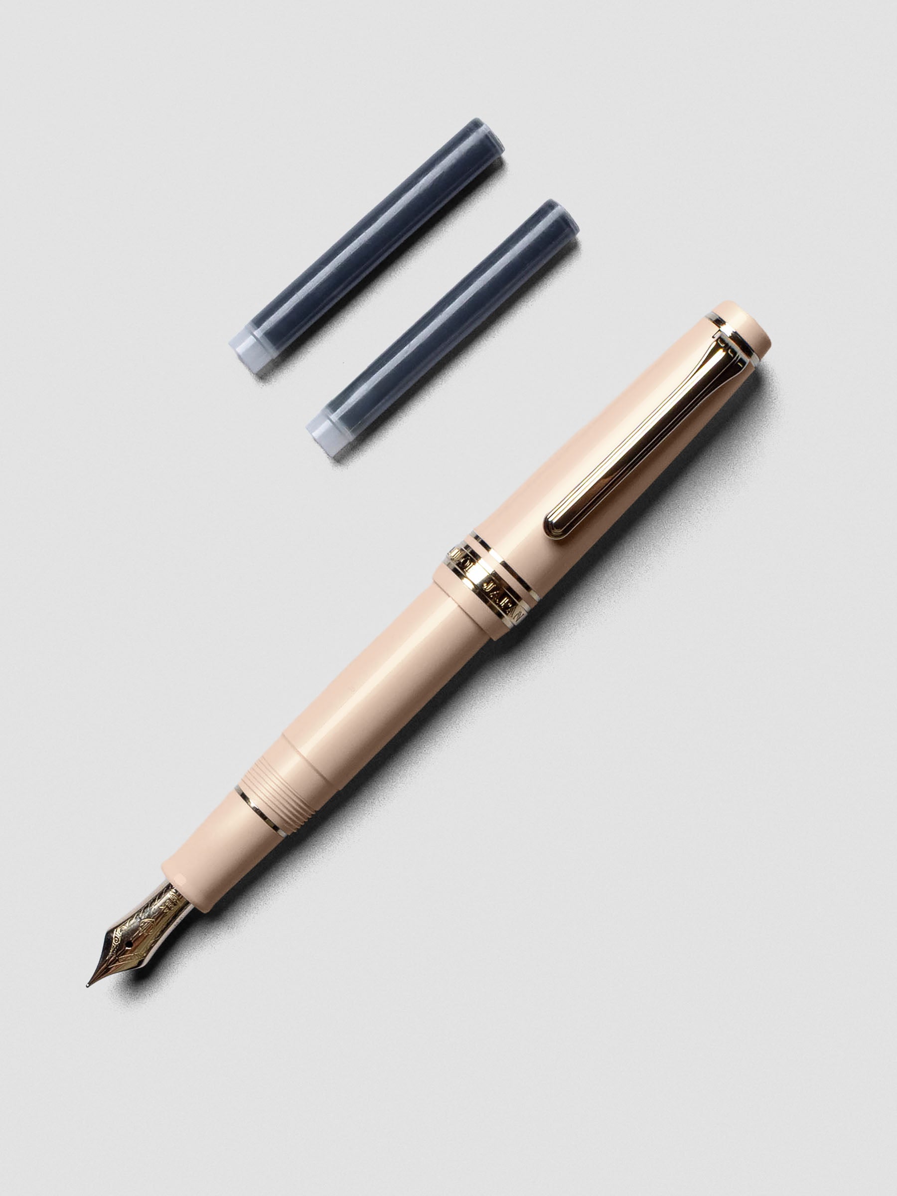 Sailor Pro Gear Slim Mini Fountain Pen in Zween Pink with cap posted on the barrel.