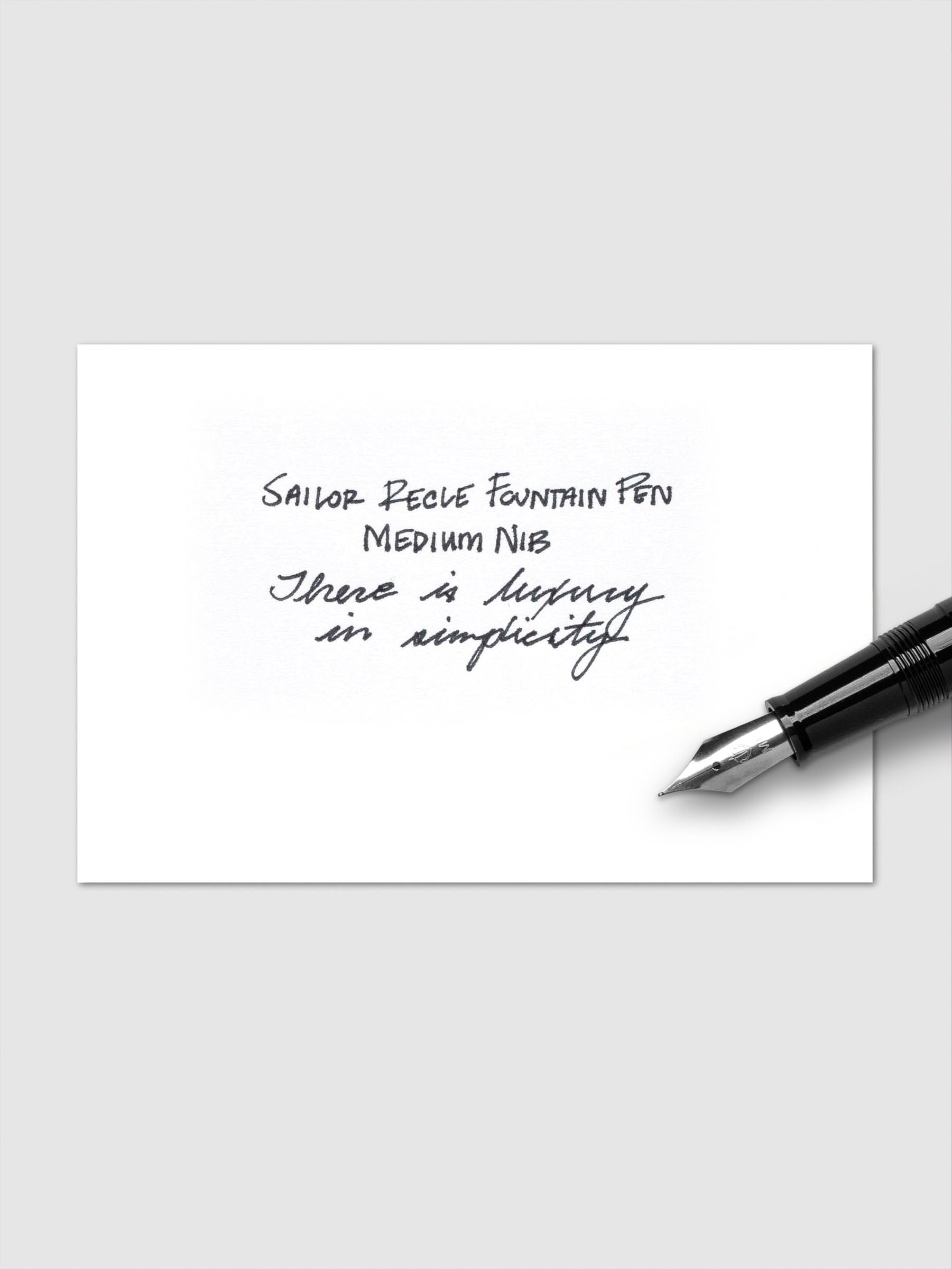 Sailor Recle Fountain Pen Medium in All Black uncapped, angled view of barrel.
