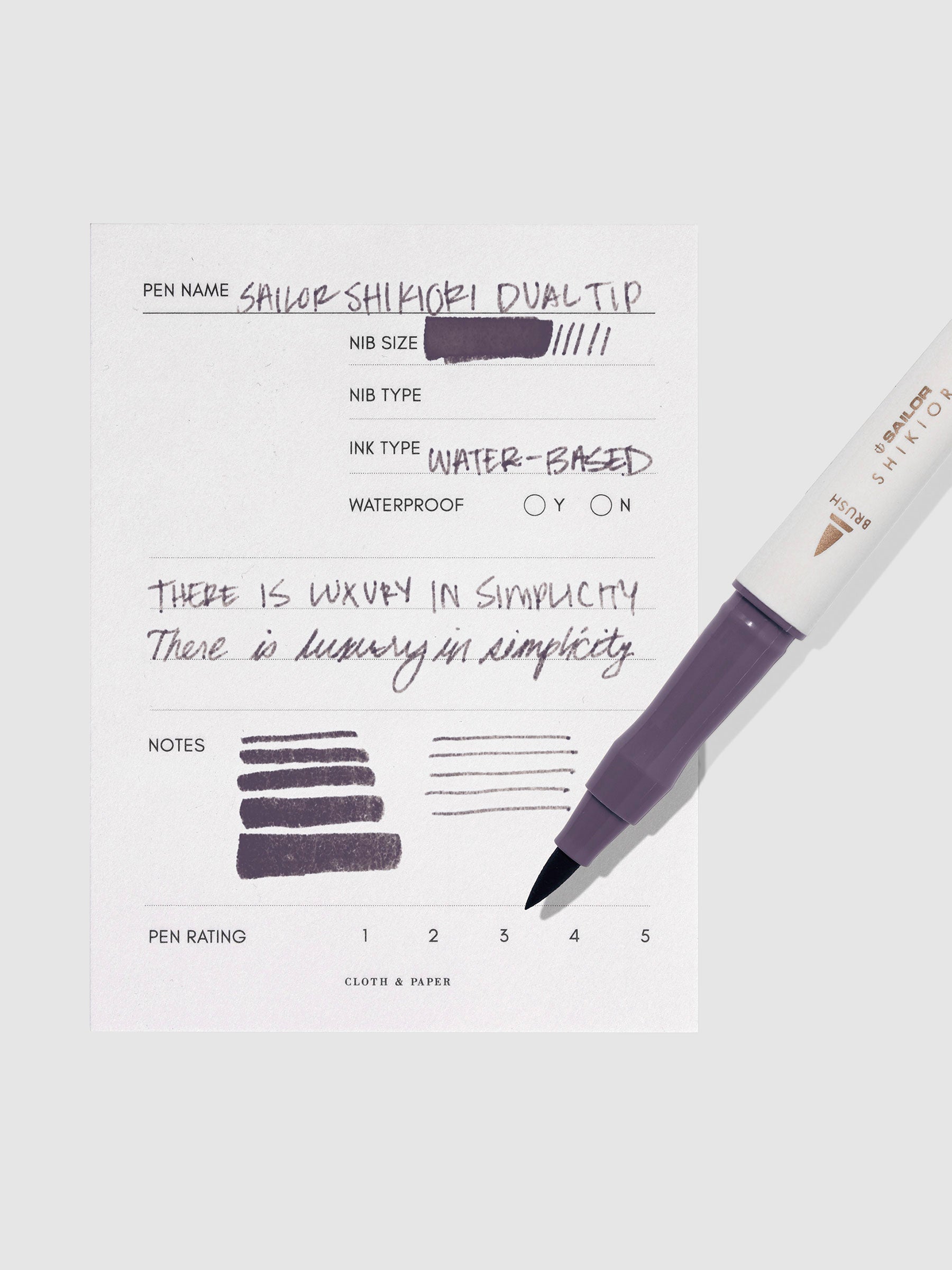 Pen displayed next to in use pen test sheet. Color pictured is Chushu.