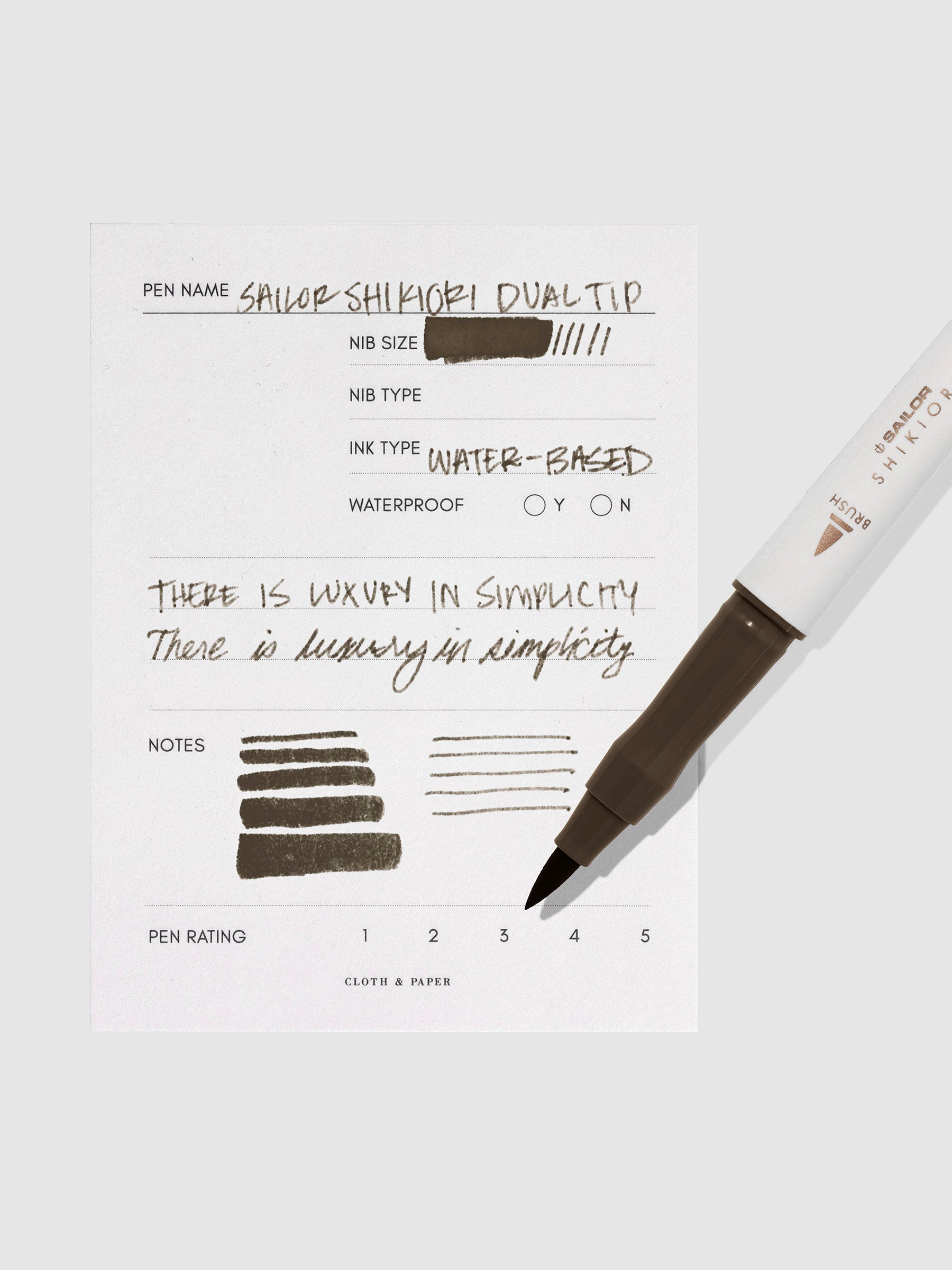 Pen displayed next to in use pen test sheet. Color pictured is Doyou.