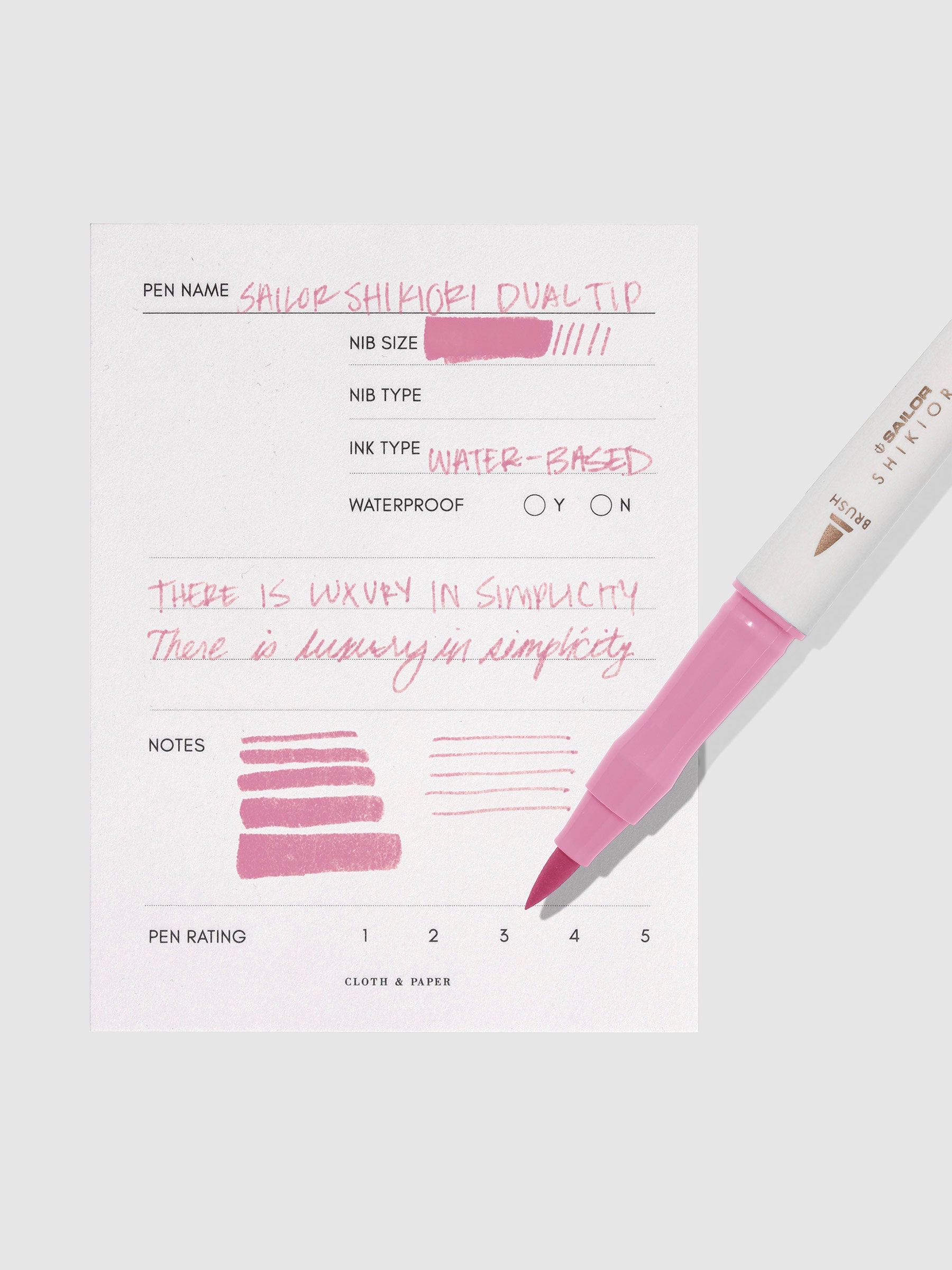 Pen displayed next to in use pen test sheet. Color pictured is Sakuramori.