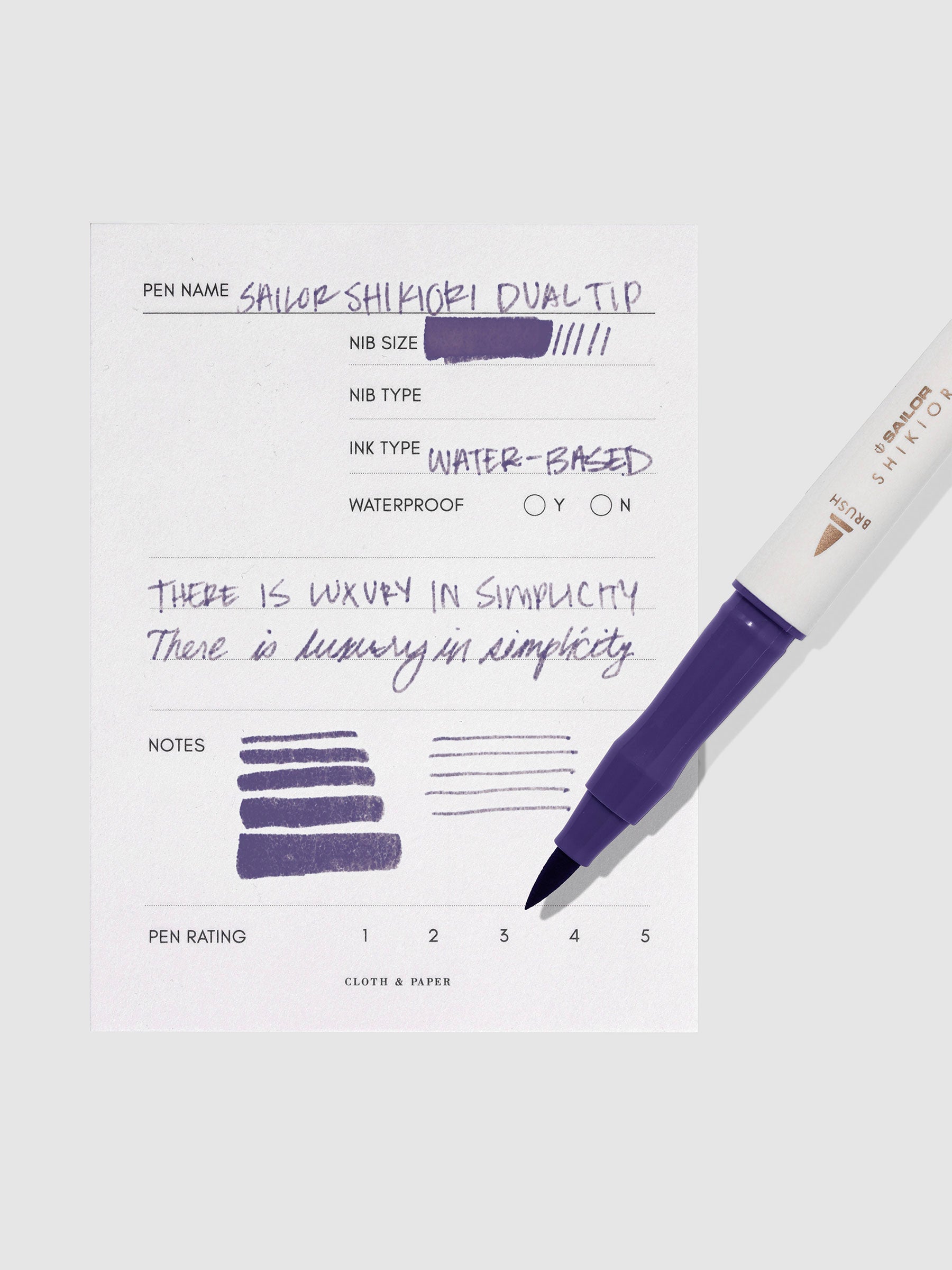 Pen displayed next to in use pen test sheet. Color pictured is Shigure.