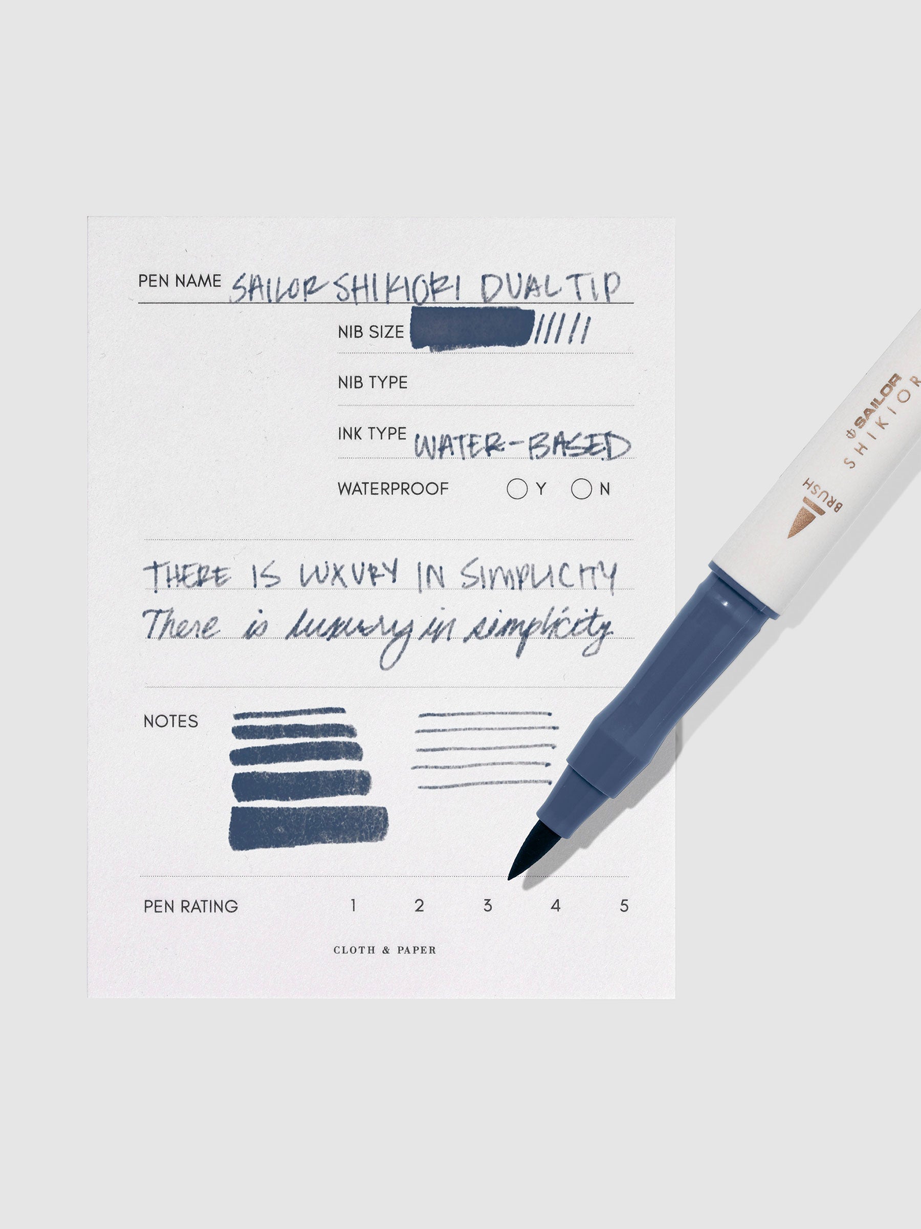 Pen displayed next to in use pen test sheet. Color pictured is Shimoyo.