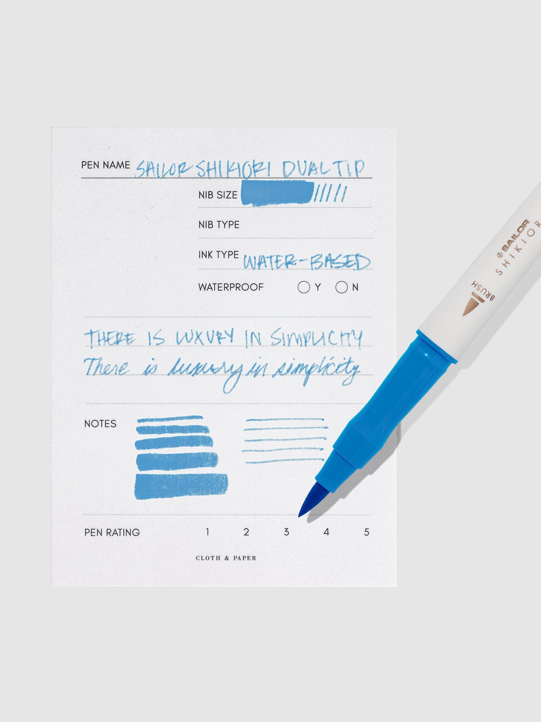 Pen displayed next to in use pen test sheet. Color pictured is Souten.