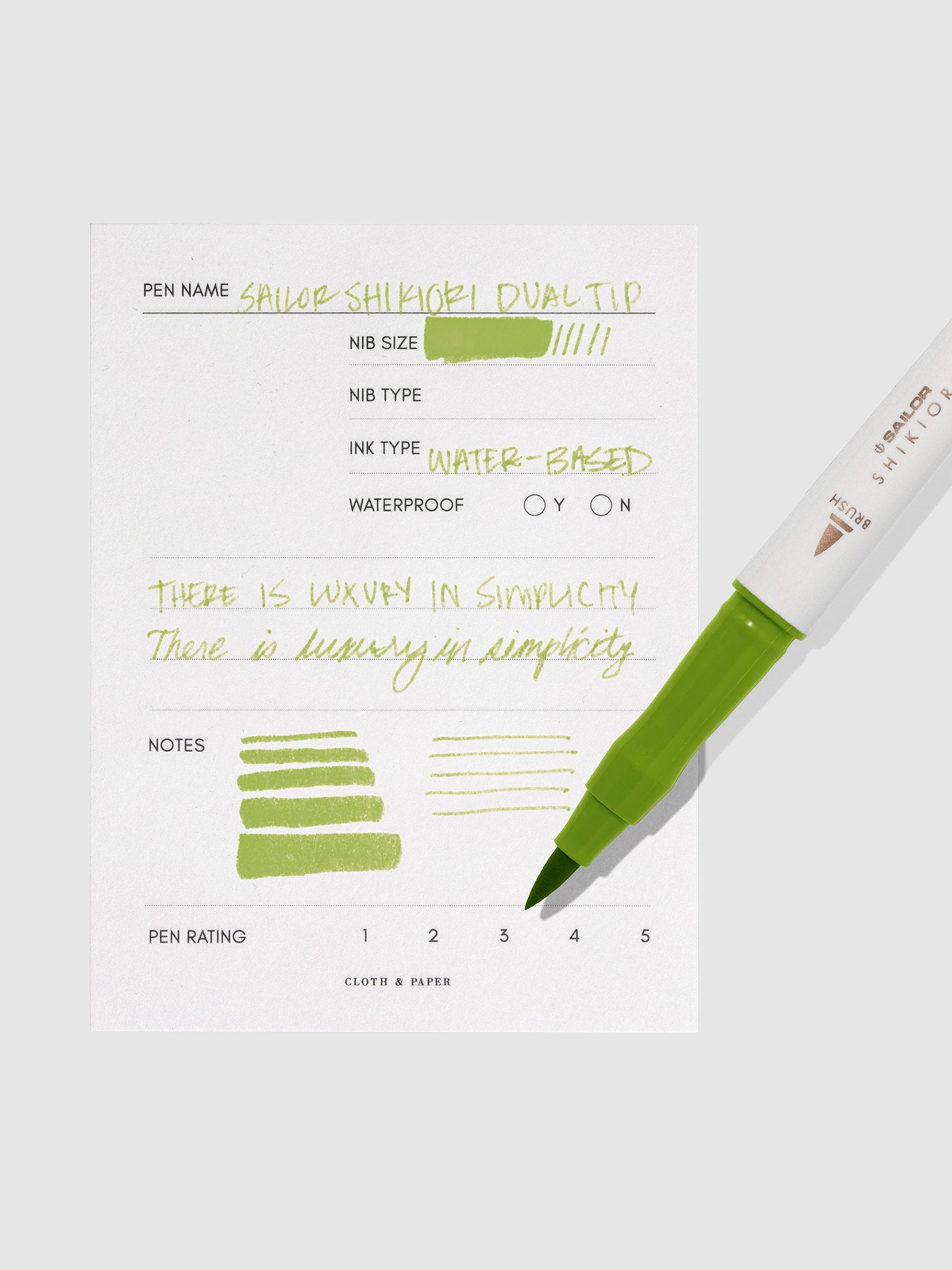 Pen displayed next to in use pen test sheet. Color pictured is Wakauguisu.