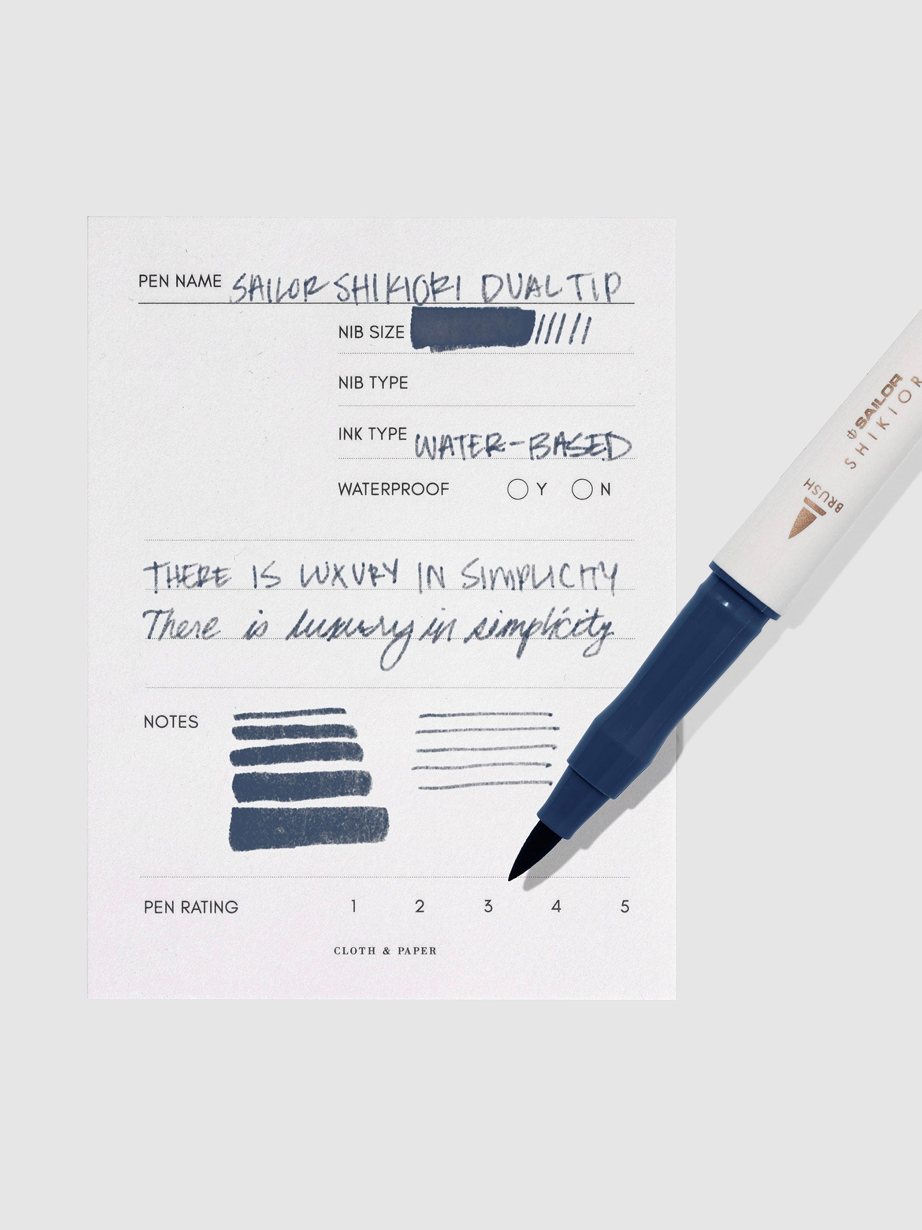 Pen displayed next to in use pen test sheet. Color pictured is Yonaga.