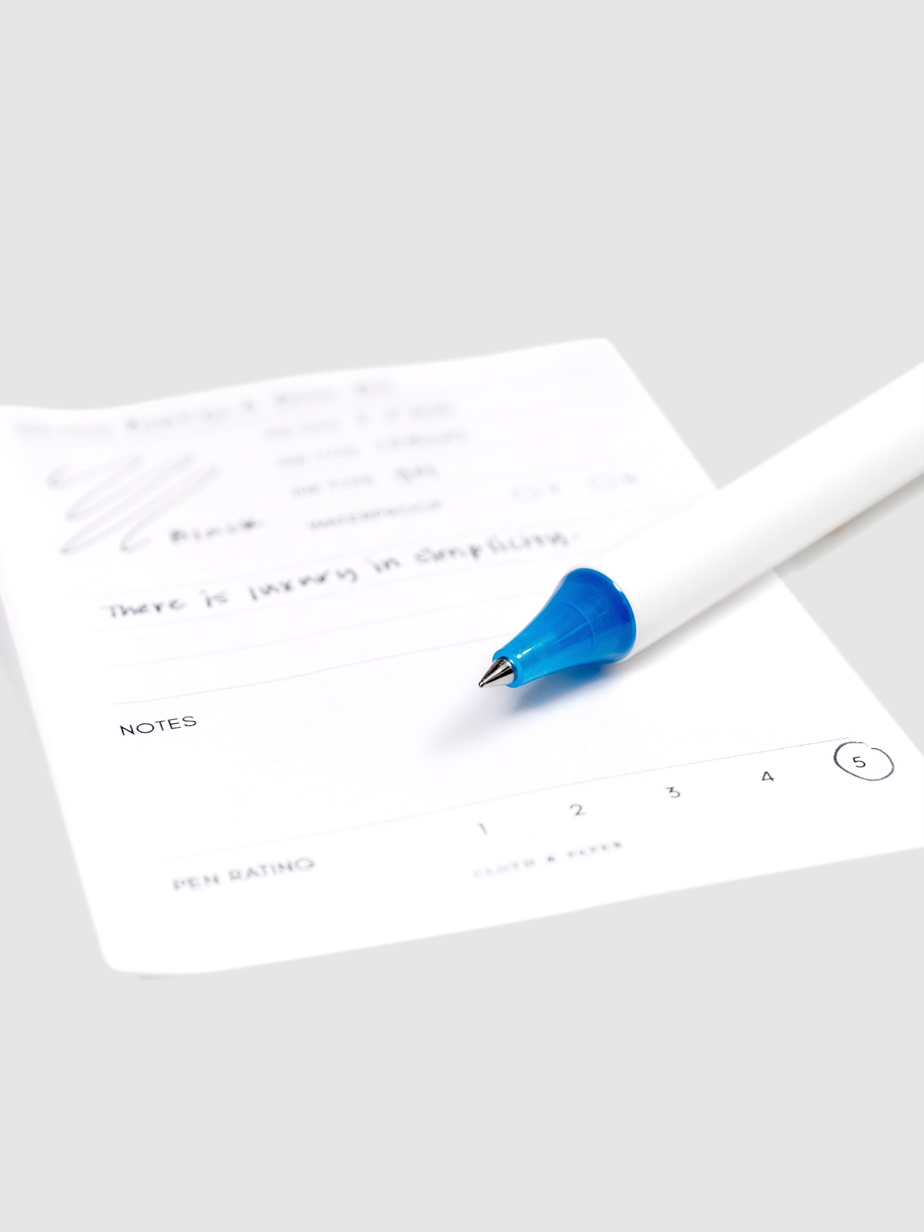 Always a Fave Pen, Dark Blue, Cloth and Paper. Close up on pen nib resting on pen test sheet.