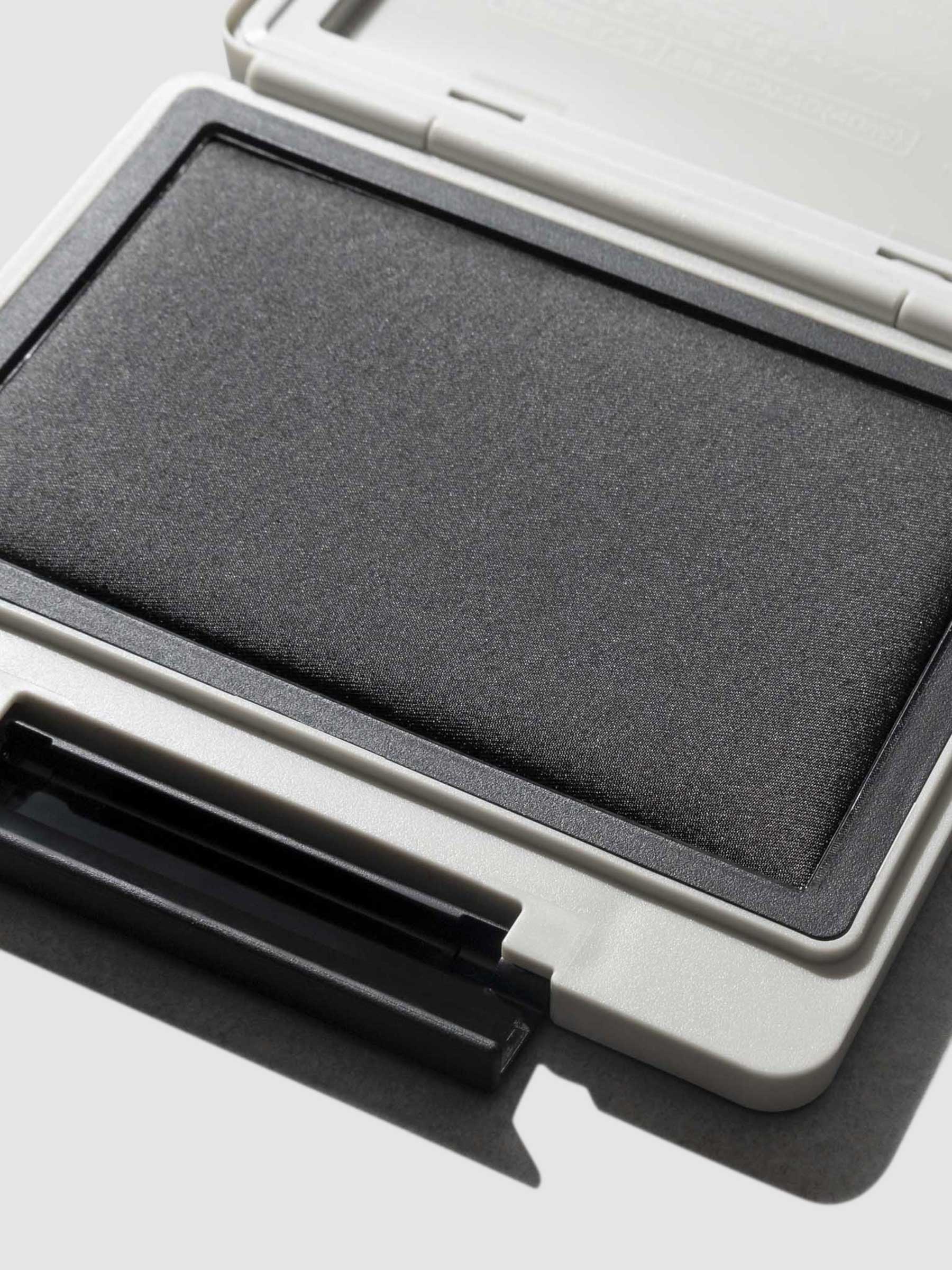 Stamp displayed open on a neutral background.