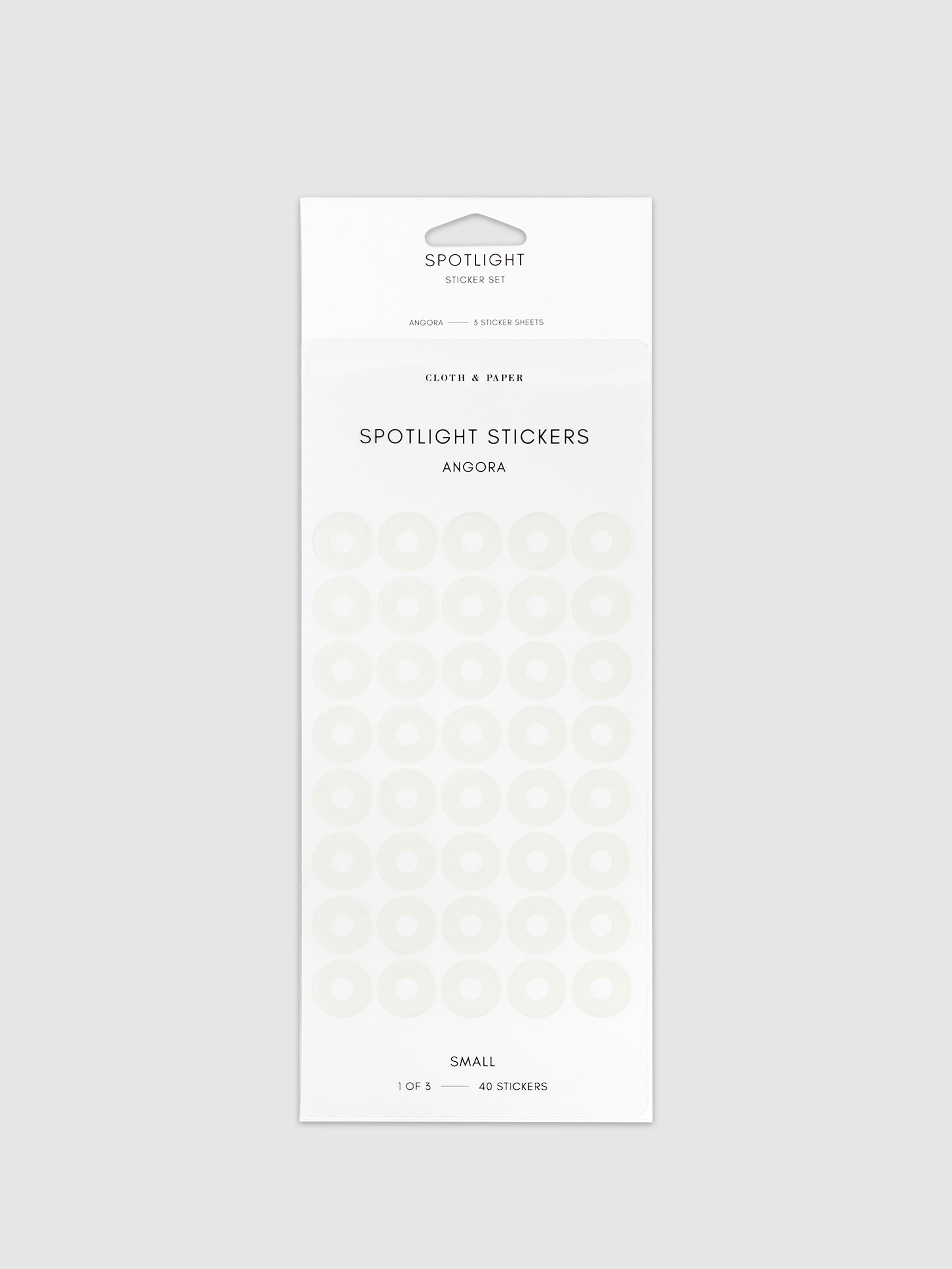 Small spotlight stickers in Angora on a neutral background.