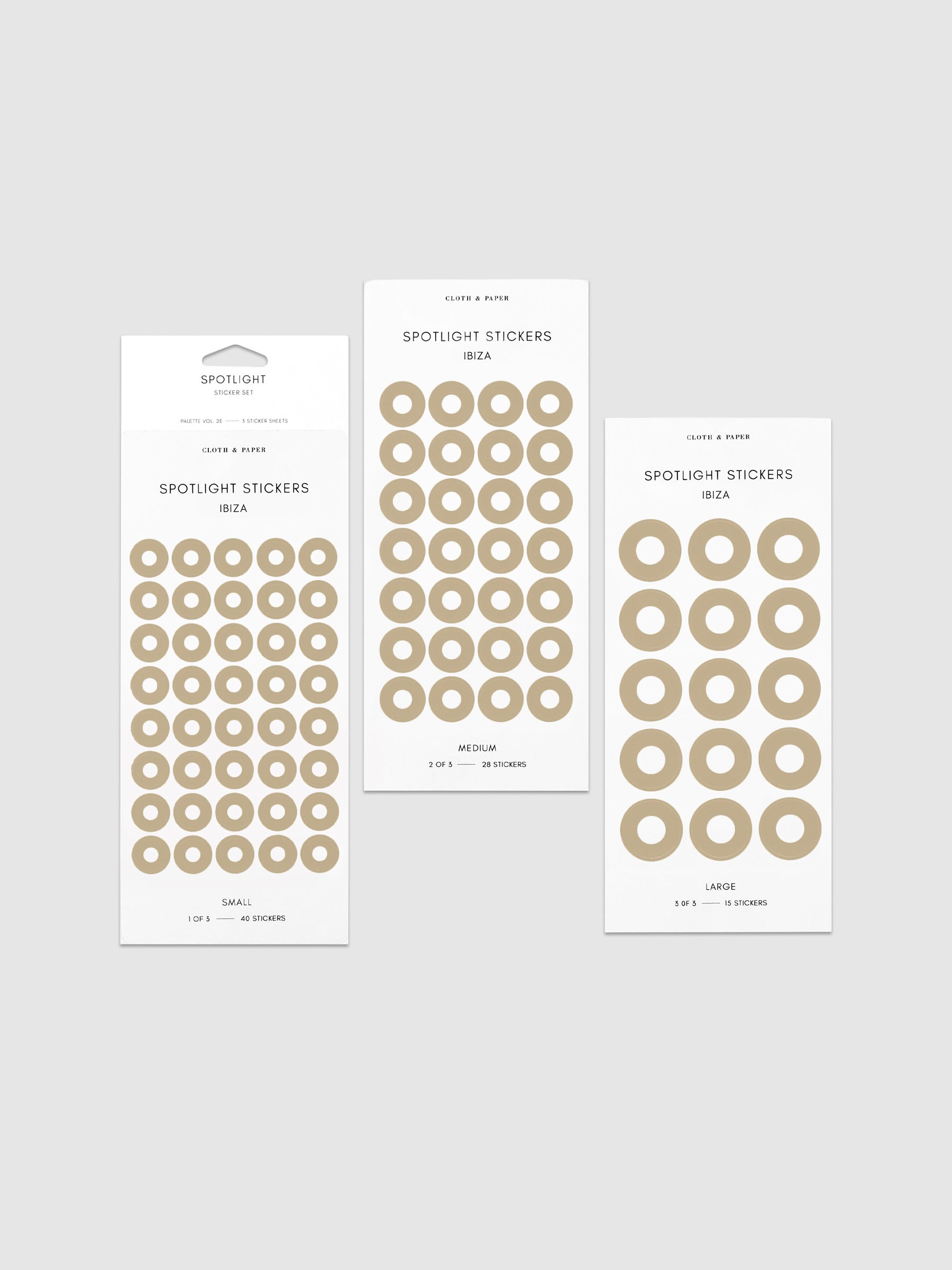Three sheets of spotlight stickers in small, medium, and large sizing arranged together on a neutral background.