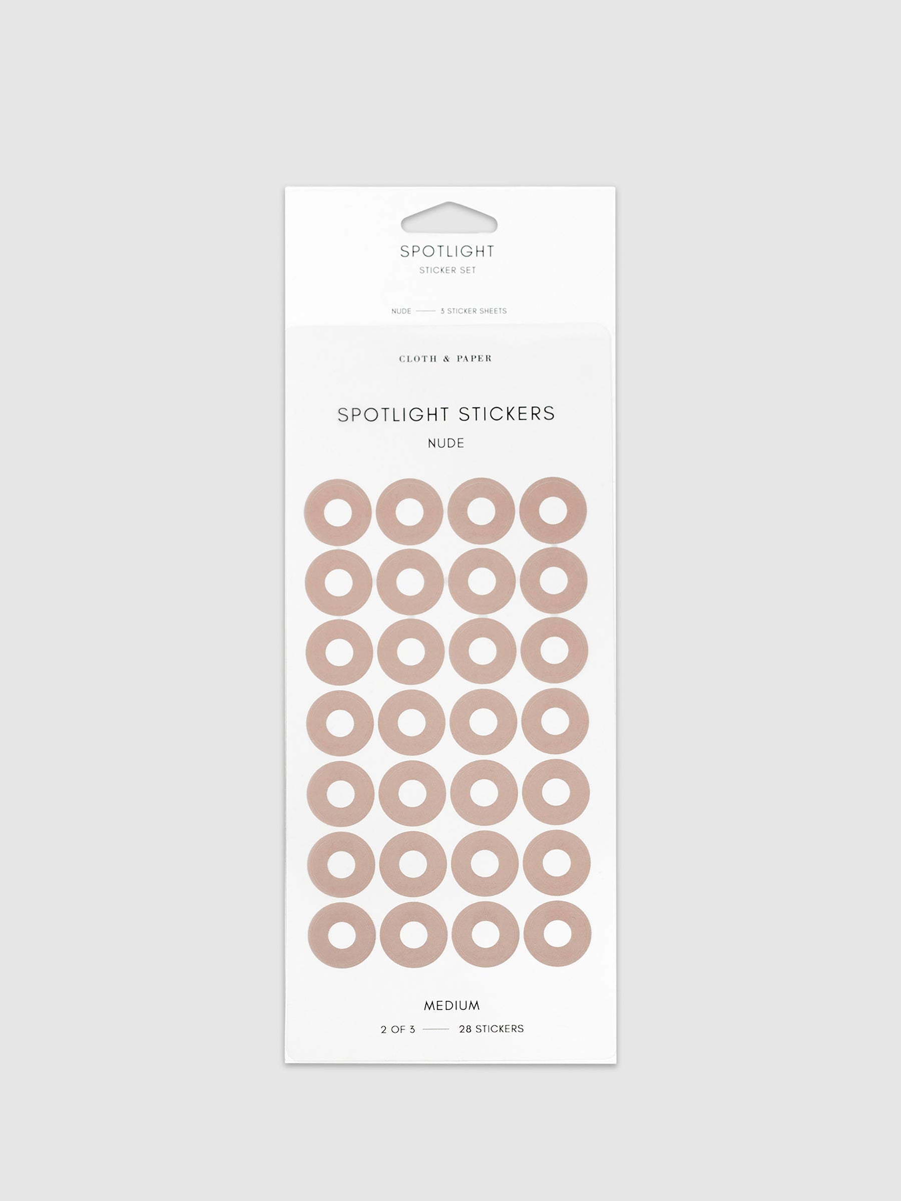 Medium sticker in its packaging displayed on a neutral background. Pictured color is nude.