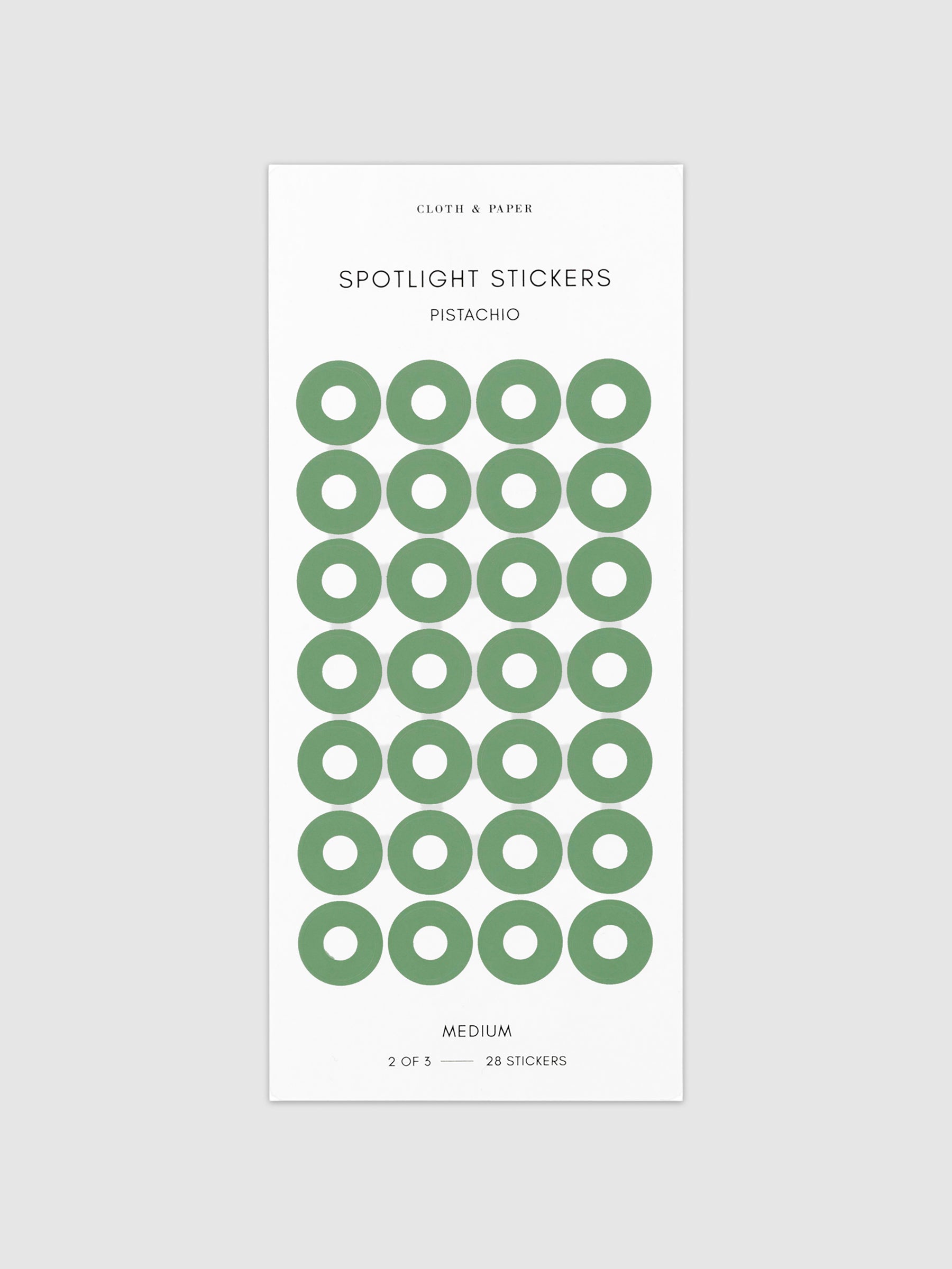 Medium sticker in its packaging displayed on a neutral background. Pictured color is pistachio.