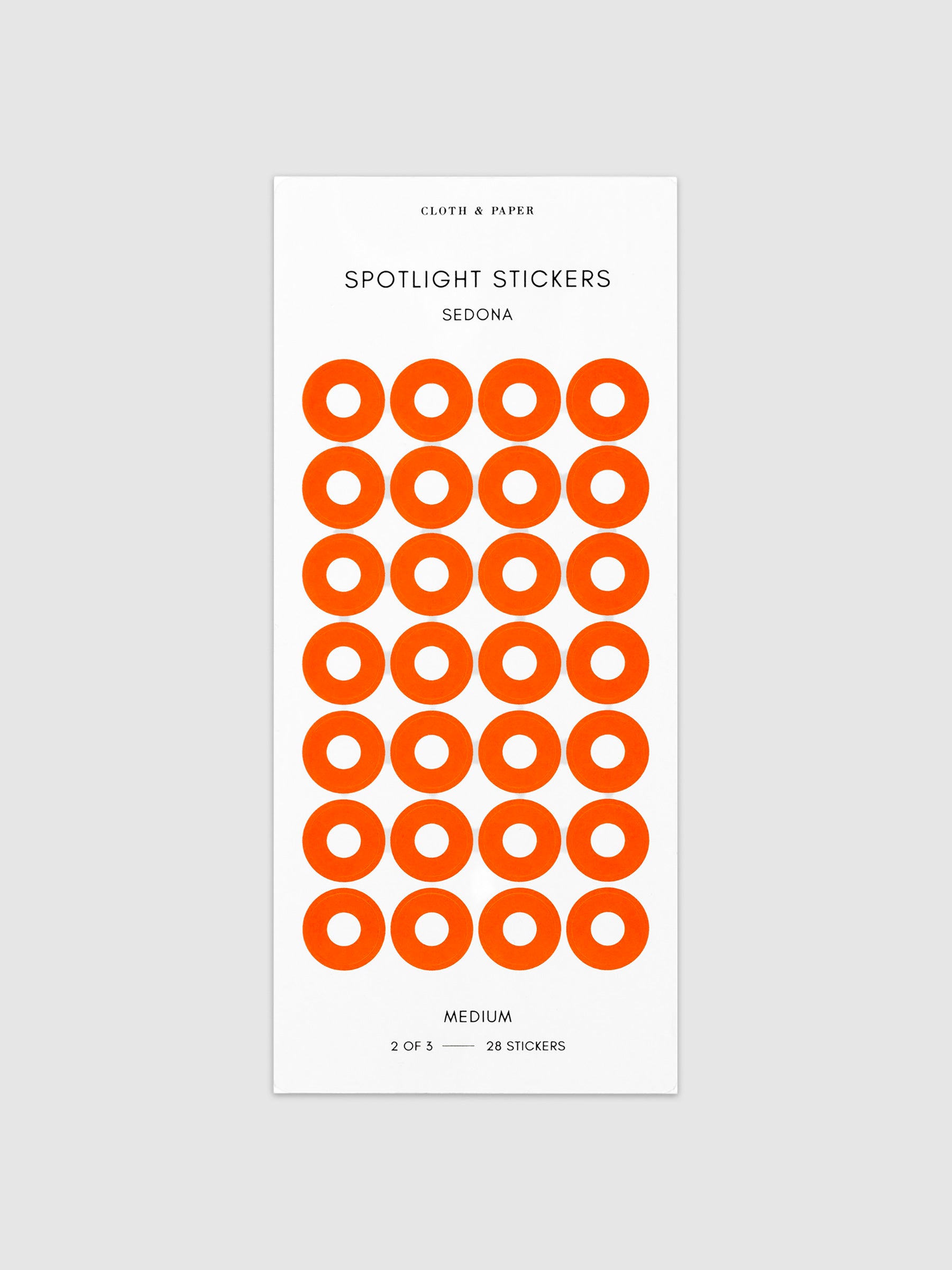 Medium sticker in its packaging displayed on a neutral background. Pictured color is sedona.