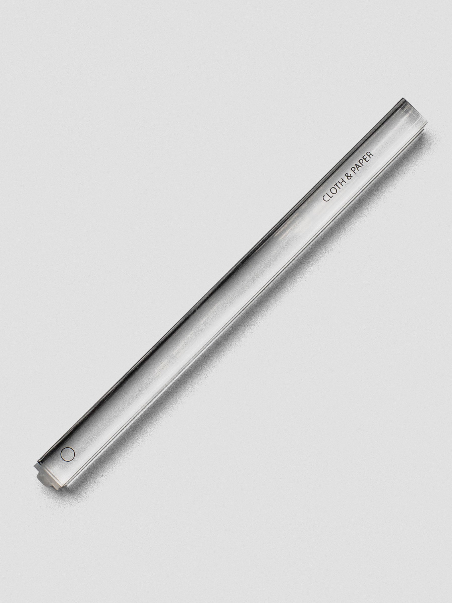 Single clear acrylic stamp stick with an outlined circle icon on the end and the Cloth & Paper logo on the side.