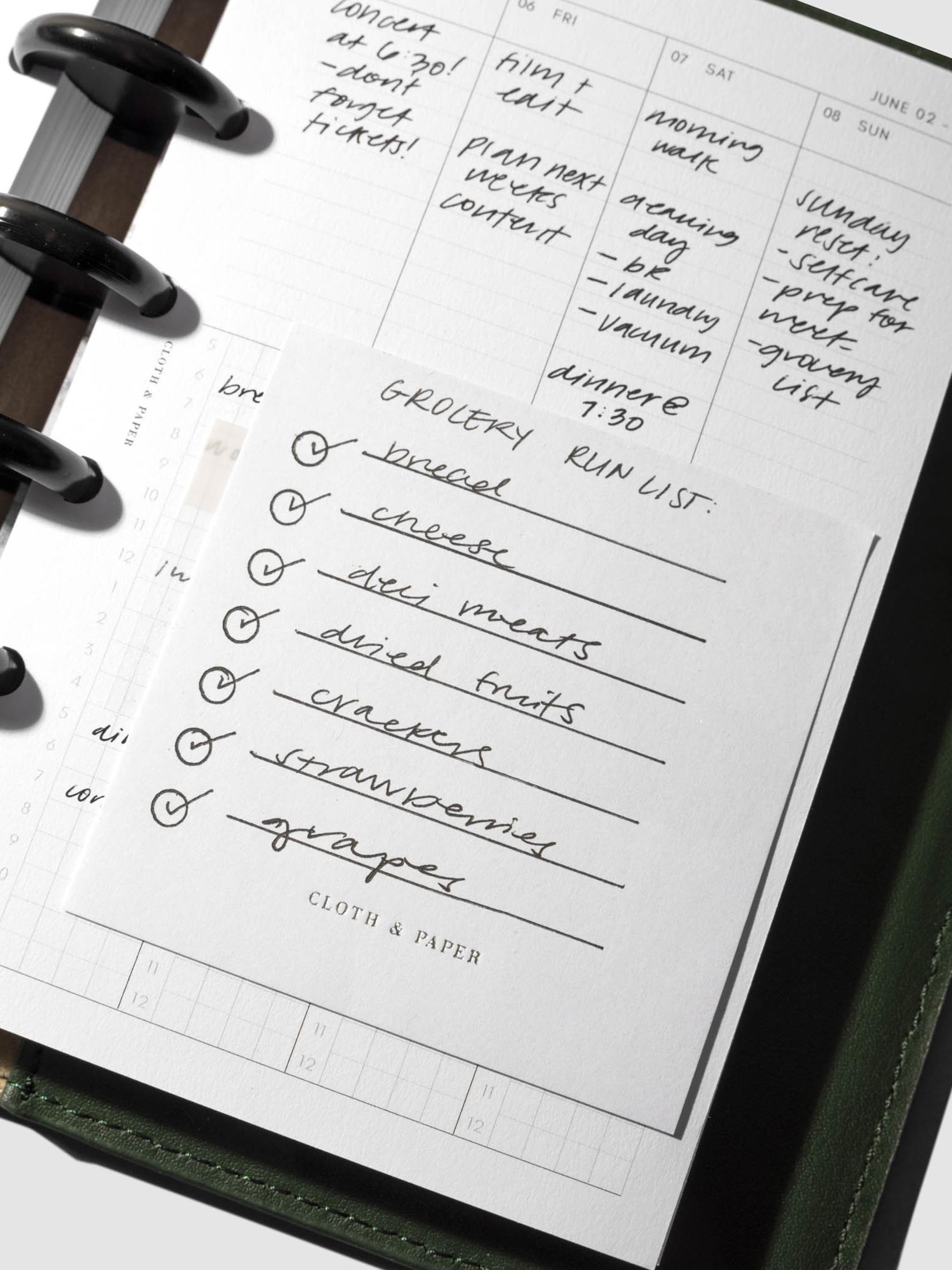 Sticky note in use inside a planner system.