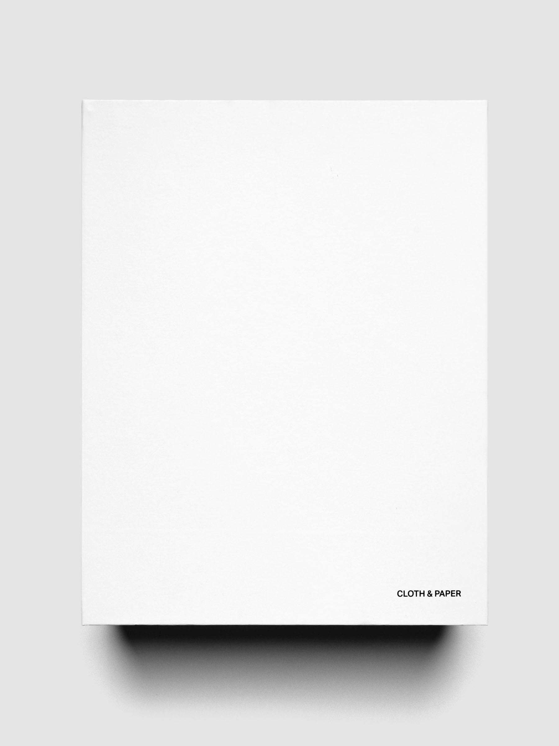 Storage Book 4.0 shown closed, laying flat, on a neutral background with Cloth & Paper logo on the front bottom right corner.