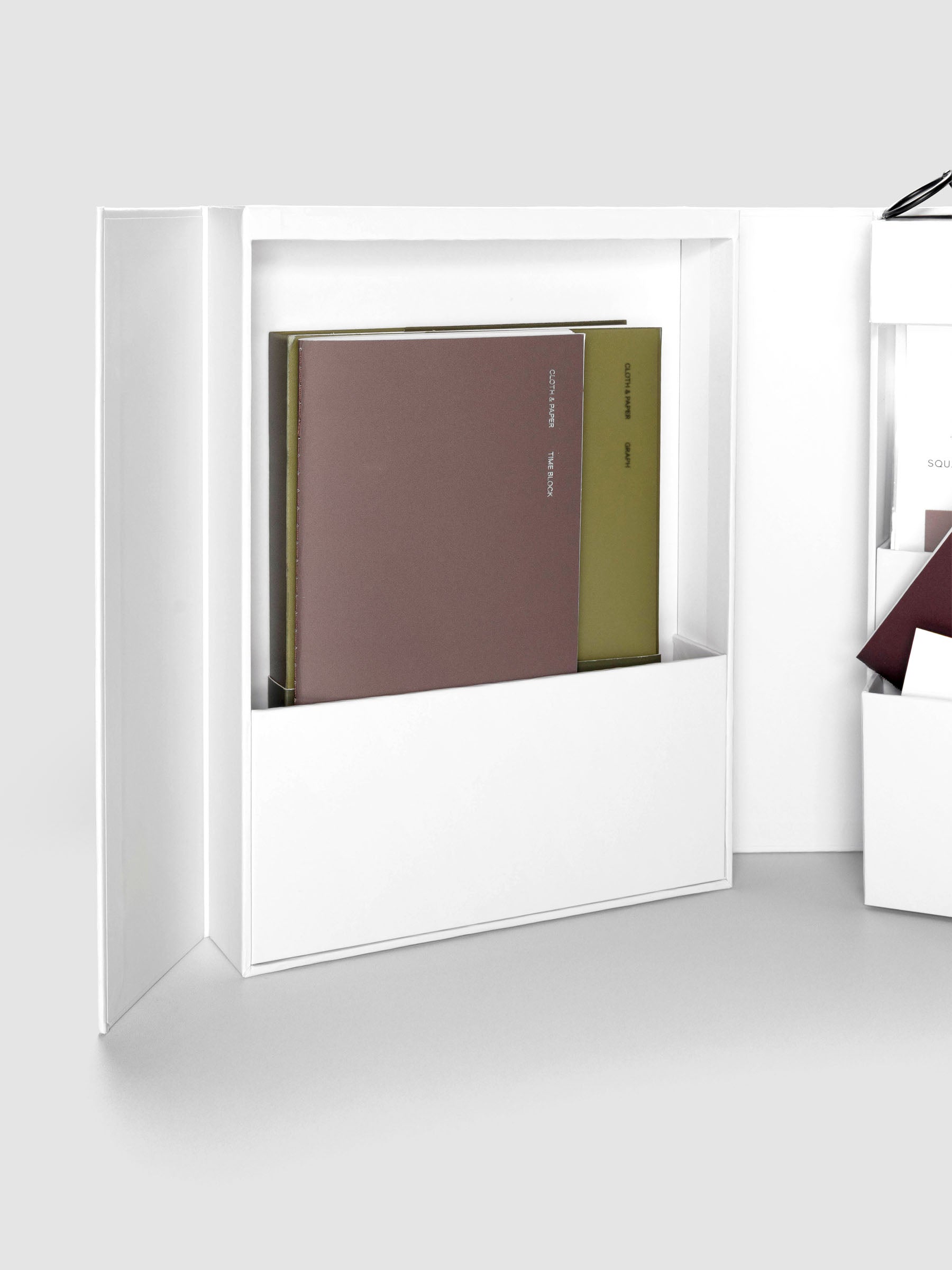 Storage Book 4.0 displayed open, showing large left-hand compartment with travel notebooks inside.