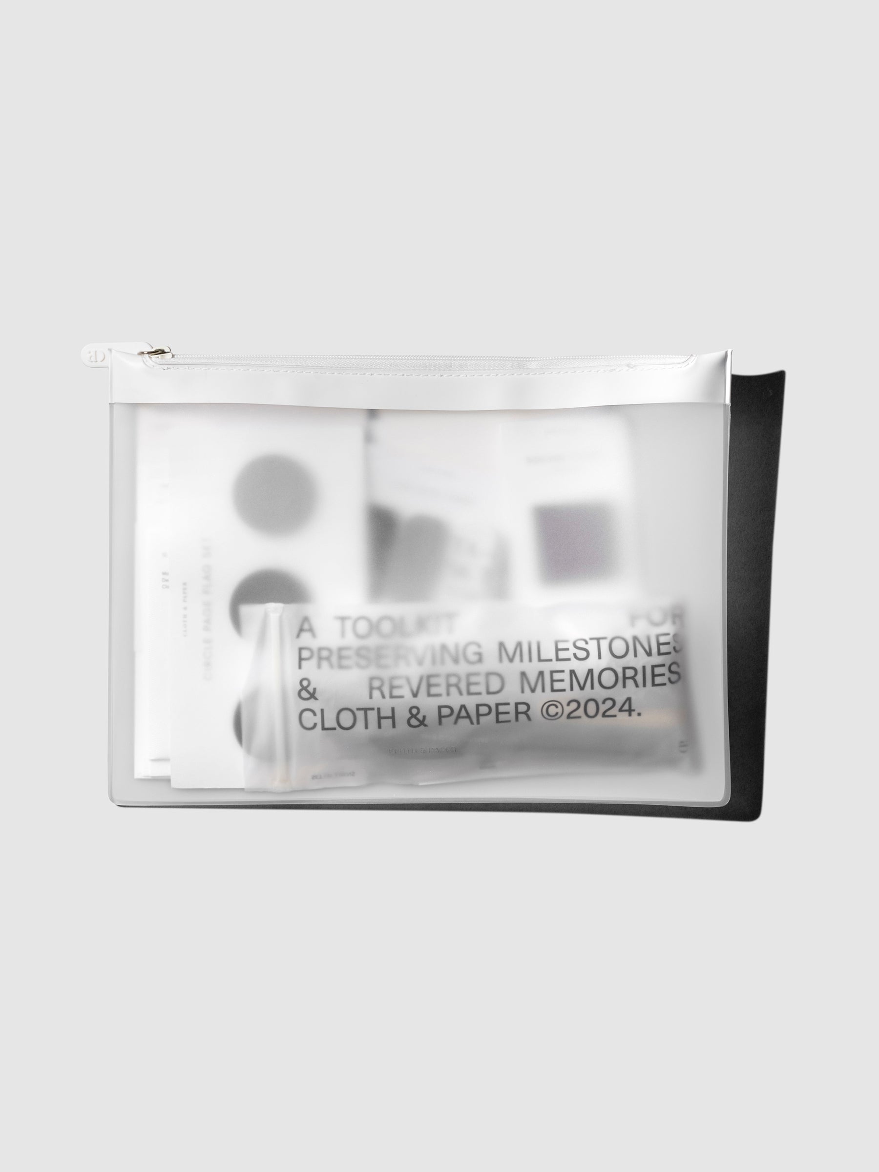 Bag shown filled with various items on a neutral background.