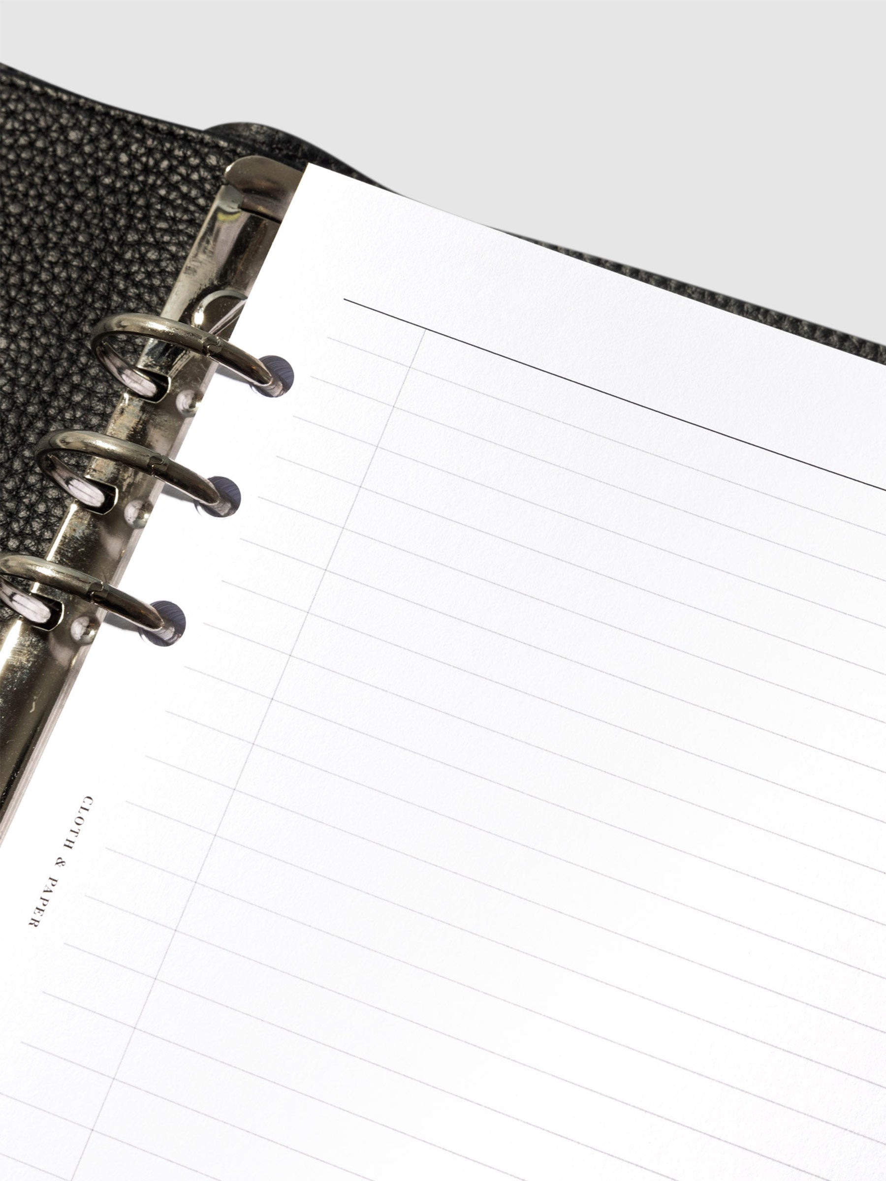 Closeup of a top left corner of an insert in a planner.