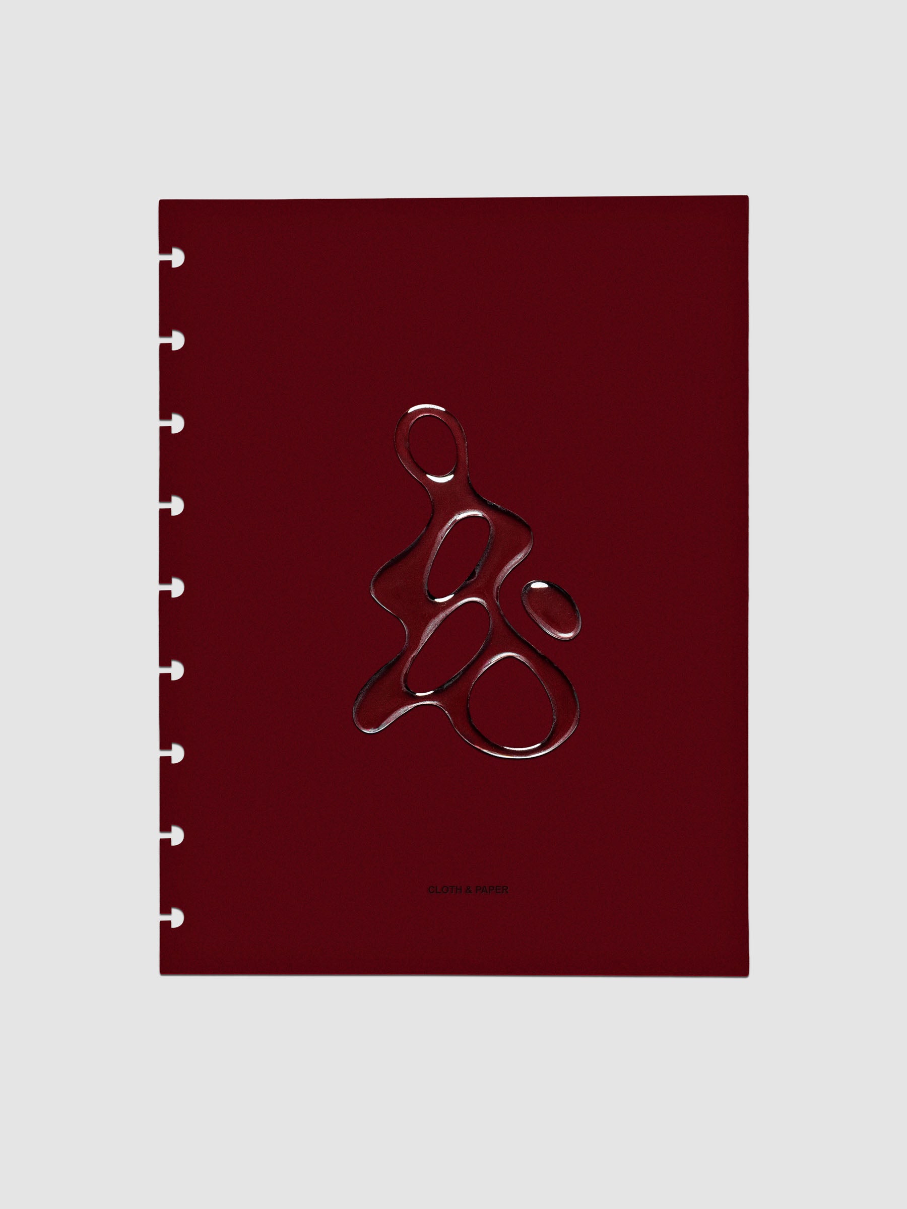 Dark red, semi-transparent, and glossy plastic planner dashboard with organic raised shape design in size HP Classic on a neutral background.