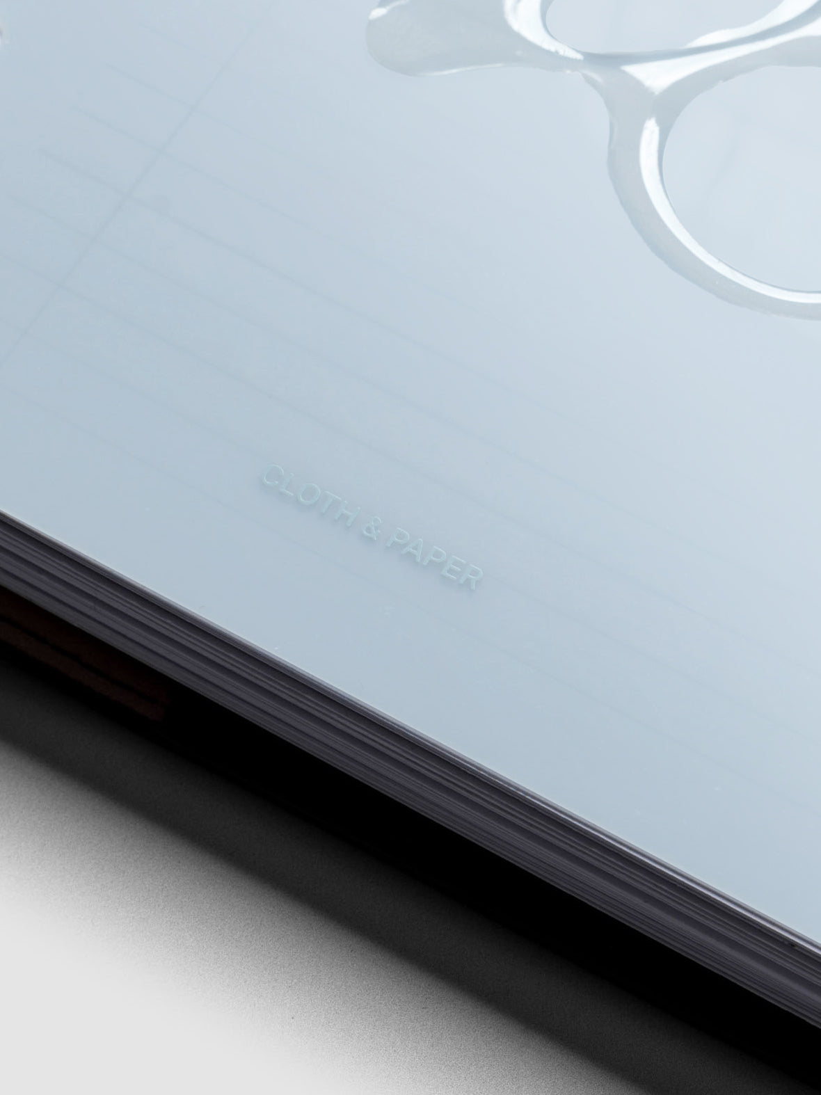 Close up image of the Gloss Form Dashboard in Smoked Salt showing the Cloth & Paper logo.