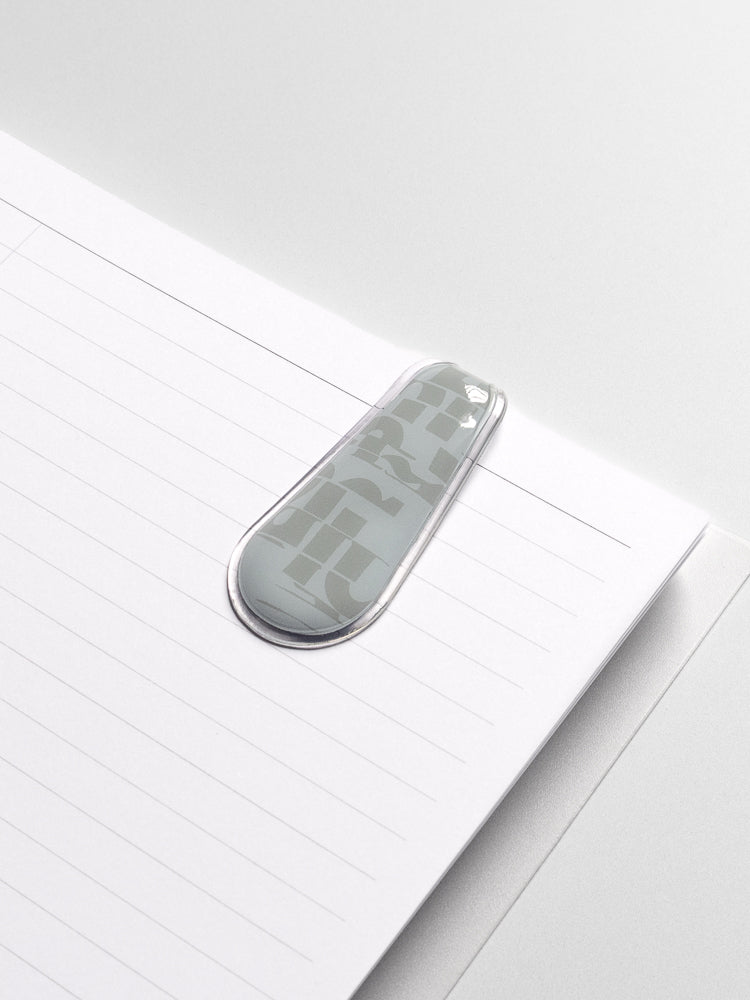 Smoked Salt (blue) Magnetic Bookmark attached to the inside of a planner.