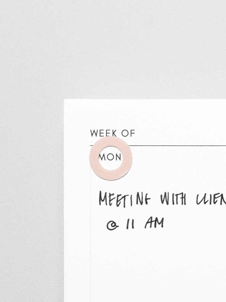 One Fig Milk Spotlight Sticker | High Gloss on a planner insert page used to highlight the day of the week.