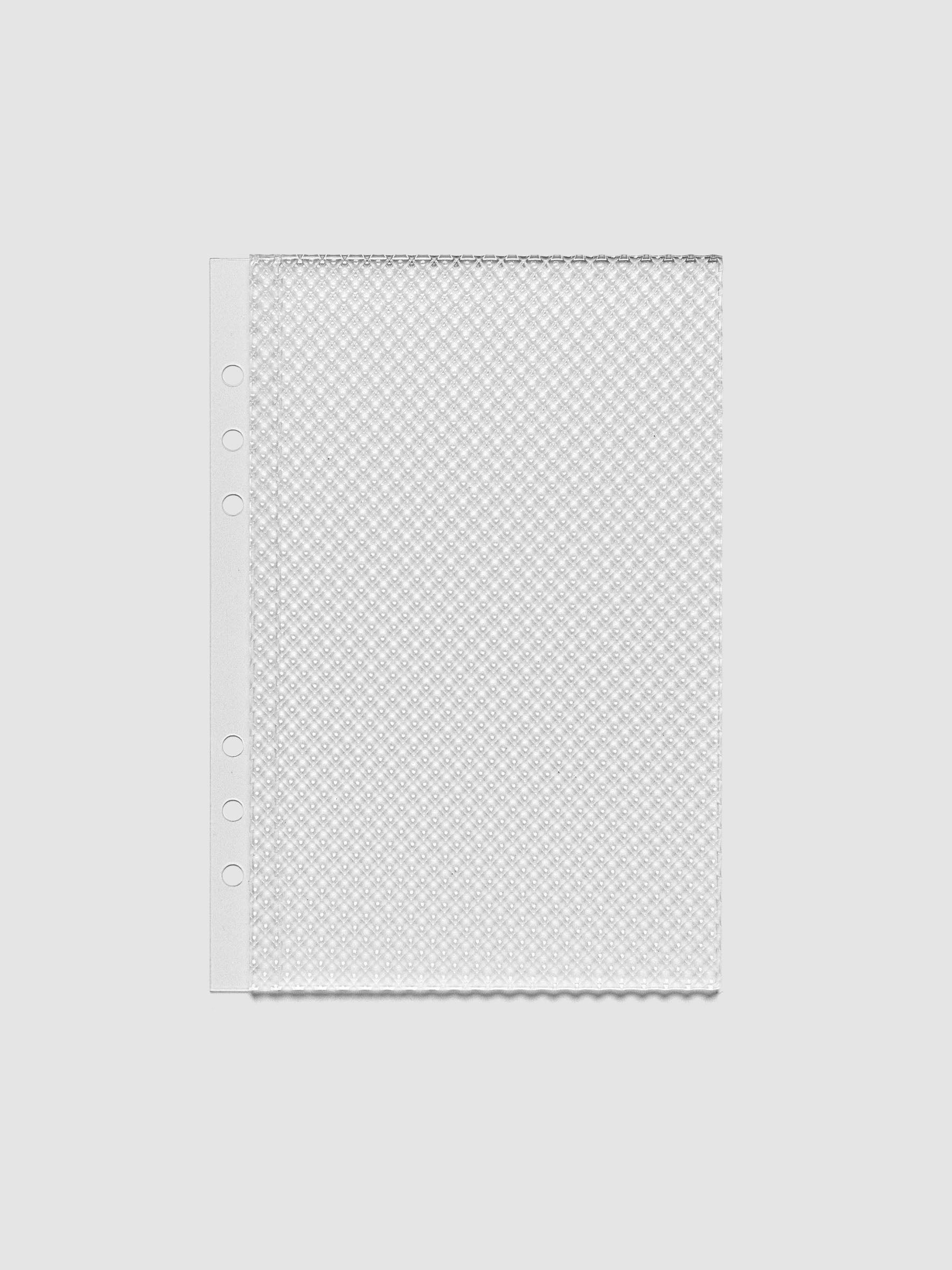 Clear, textured Studded Planner Dashboard in the size A5, on a neutral background.