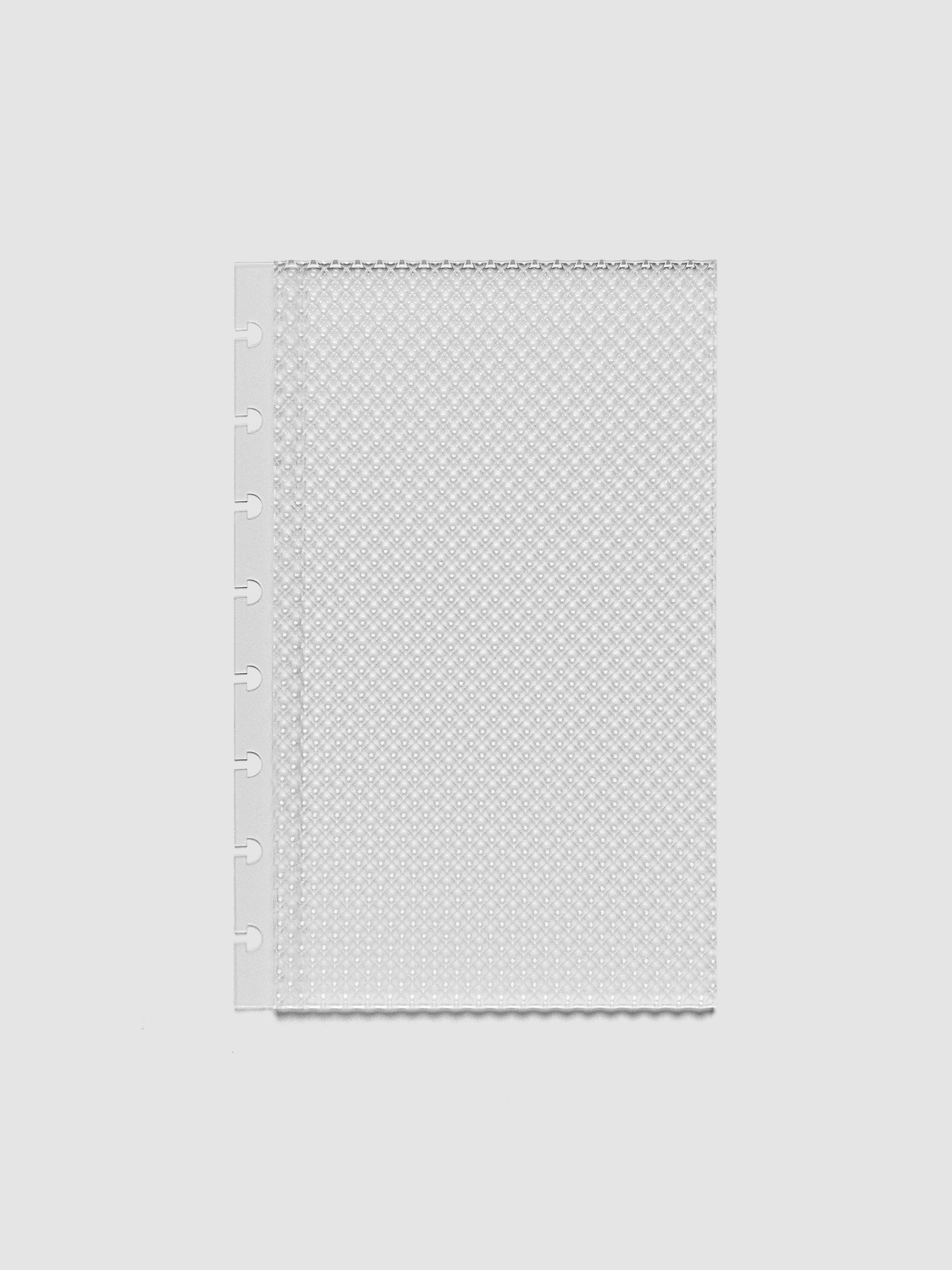 Clear, textured Studded Planner Dashboard in the size Half Letter, on a neutral background.
